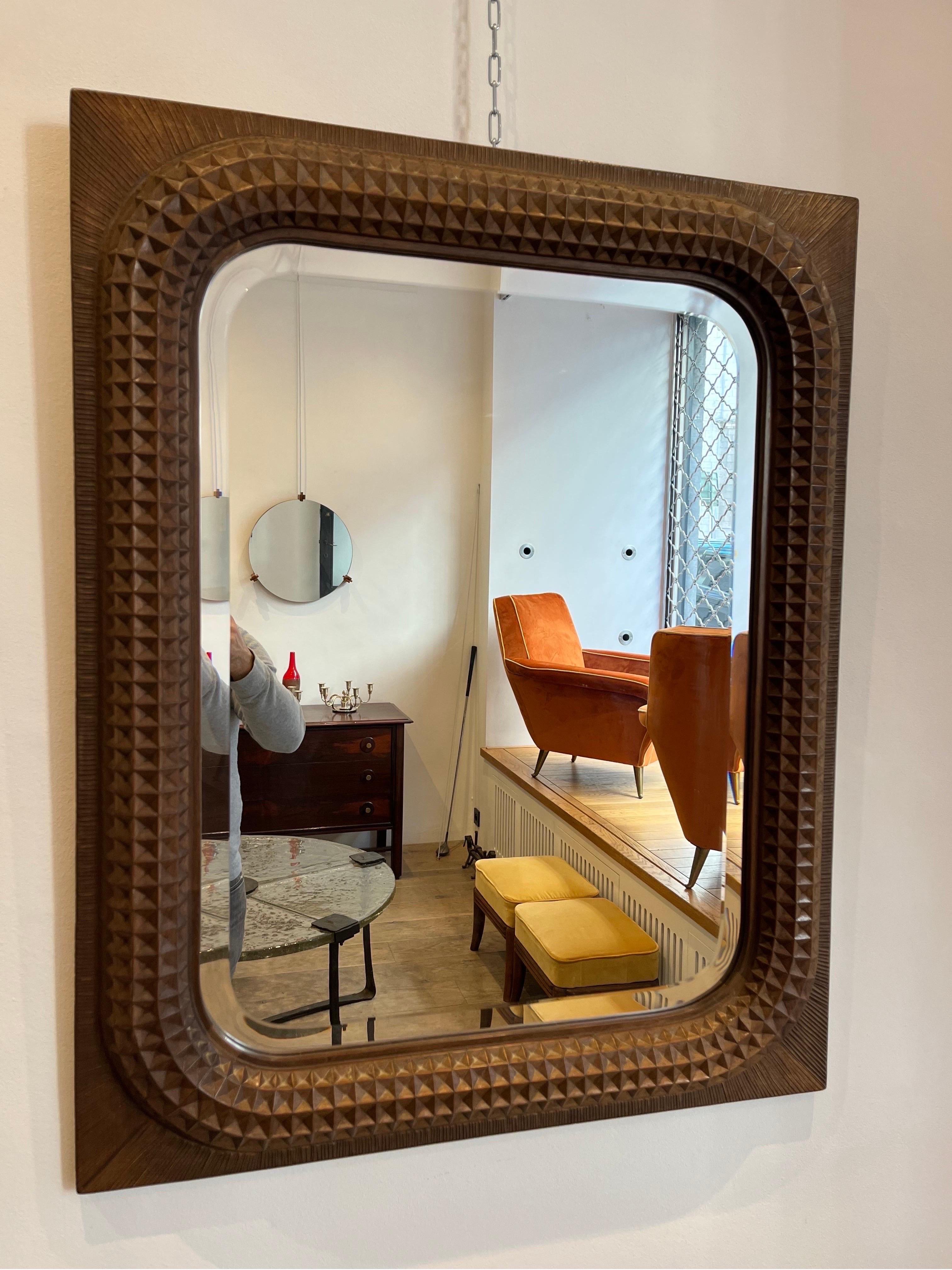 Giuseppe Rivadossi is a designer and cabinet maker still active in Brescia. His company, Officina Rivadossi, still creates design by his hand. All his designs are his own creations. The present mirror was created in the late 1970s early 80s. It is