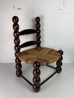 Brutalist wood turned bobbin low rush chair France, 1950s