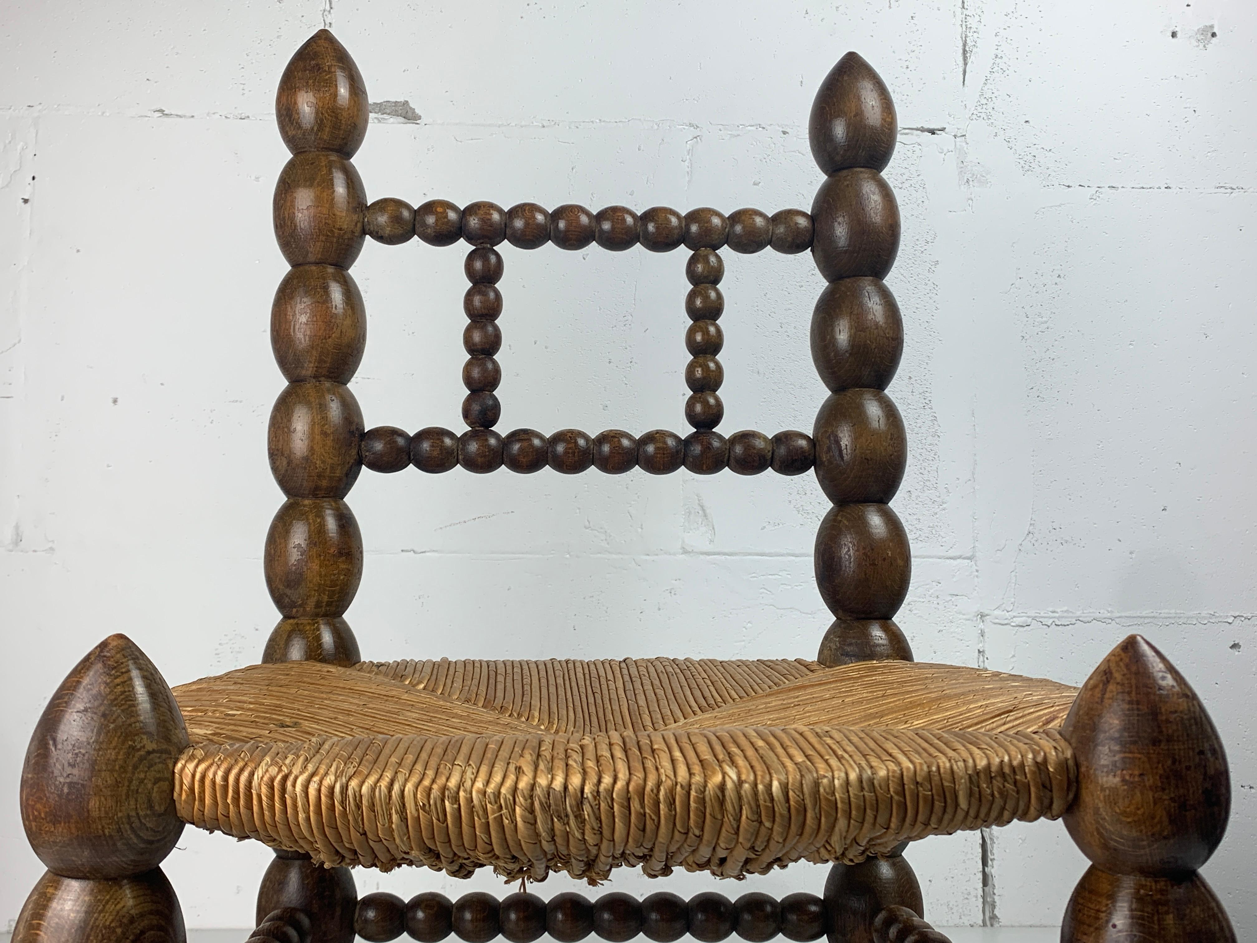 Brutalist wood turned bobbin low rush chair in the style of Charles Dudouyt 6