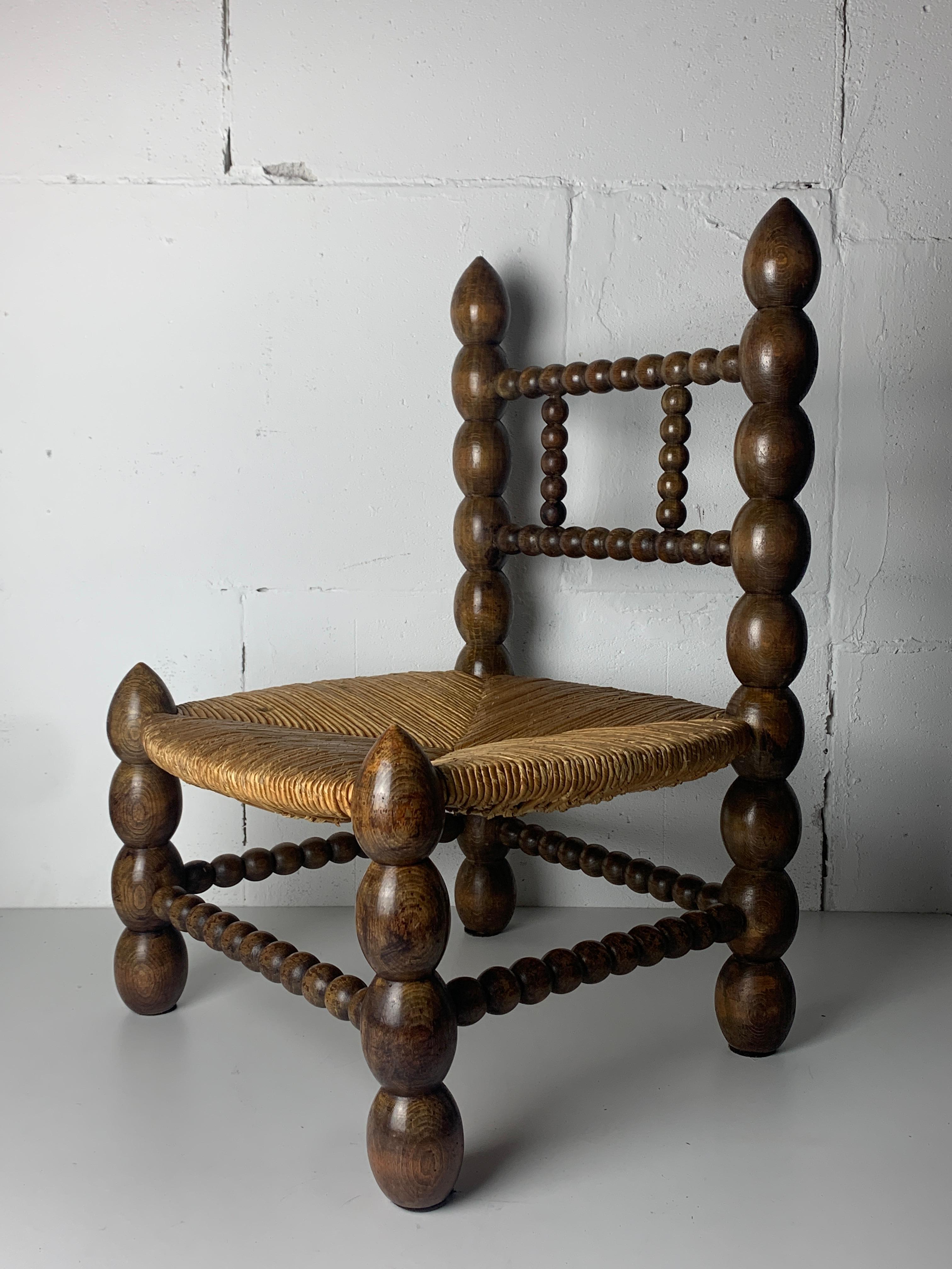 Brutalist wood turned bobbin low rush chair in the style of Charles Dudouyt 7