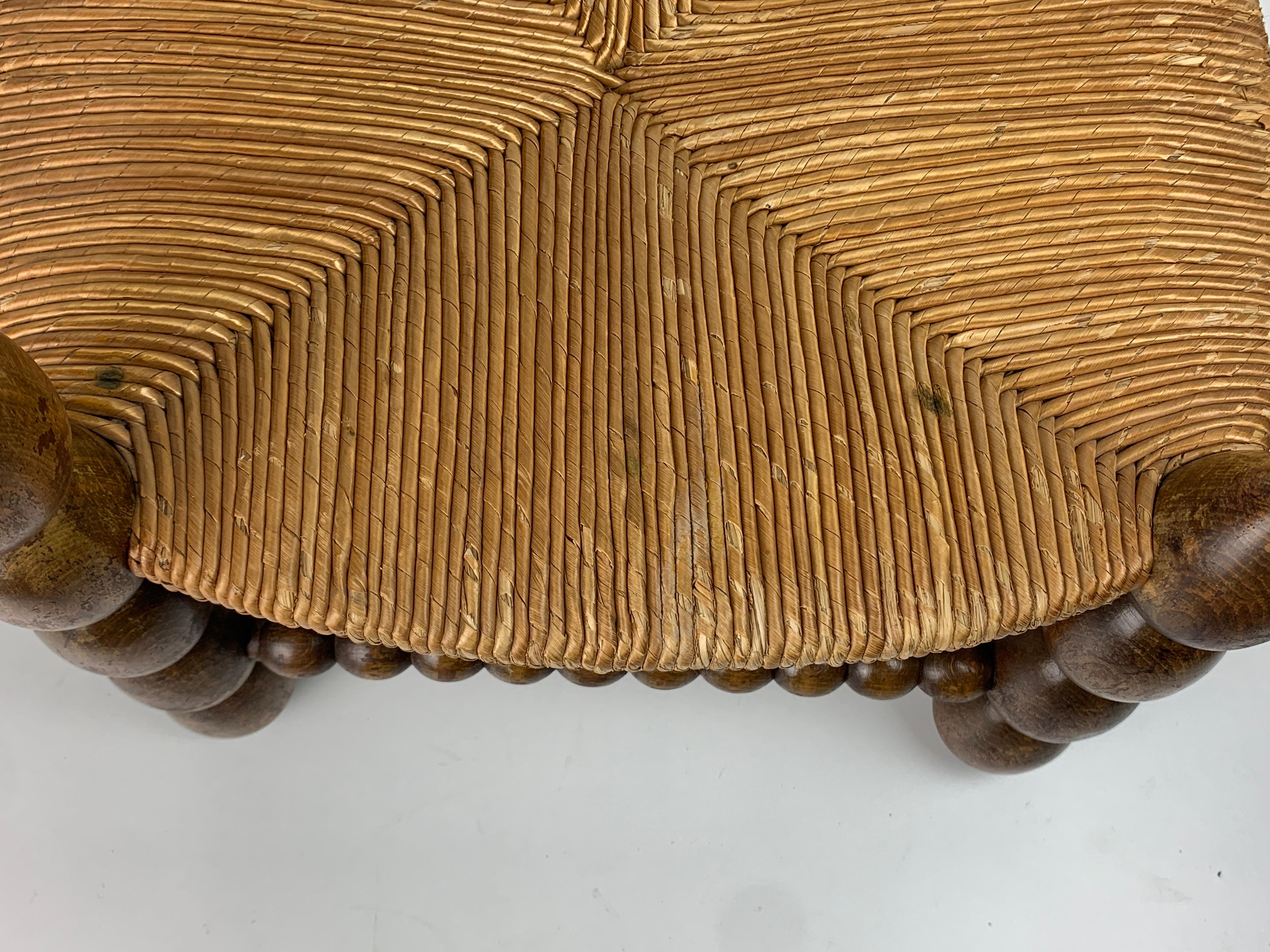 Brutalist wood turned bobbin low rush chair in the style of Charles Dudouyt 8