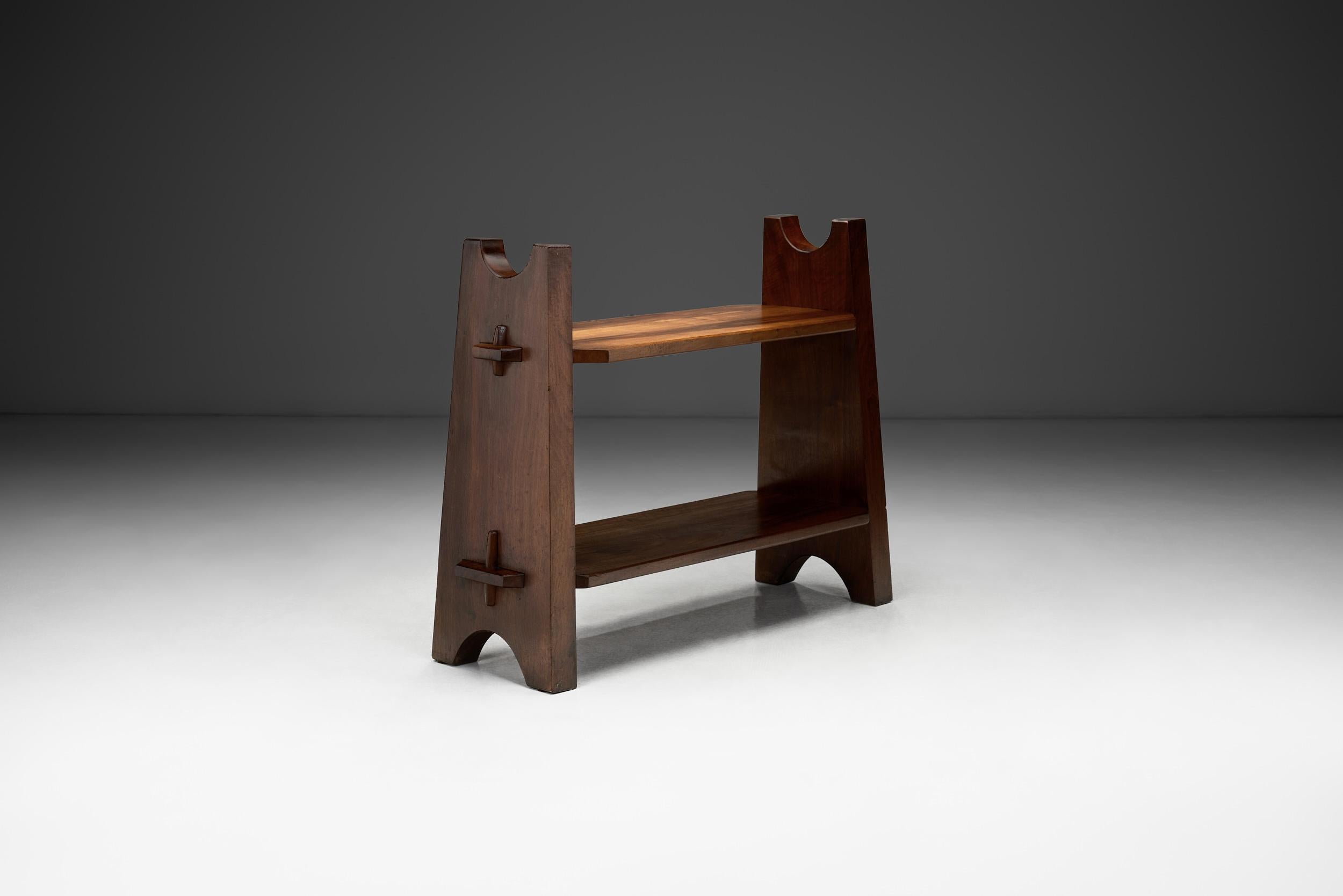 In general, Brutalist furniture stands as a testament to the visual benefits of the marriage of raw aesthetics and functional brilliance. Crafted from robust exotic wood, a timeless material, this shelf is a striking embodiment of the Brutalist