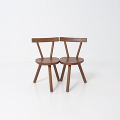 Brutalist wooden chair in the style of Jean Touret