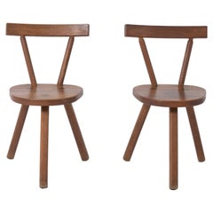 Brutalist wooden chair in the style of Jean Touret