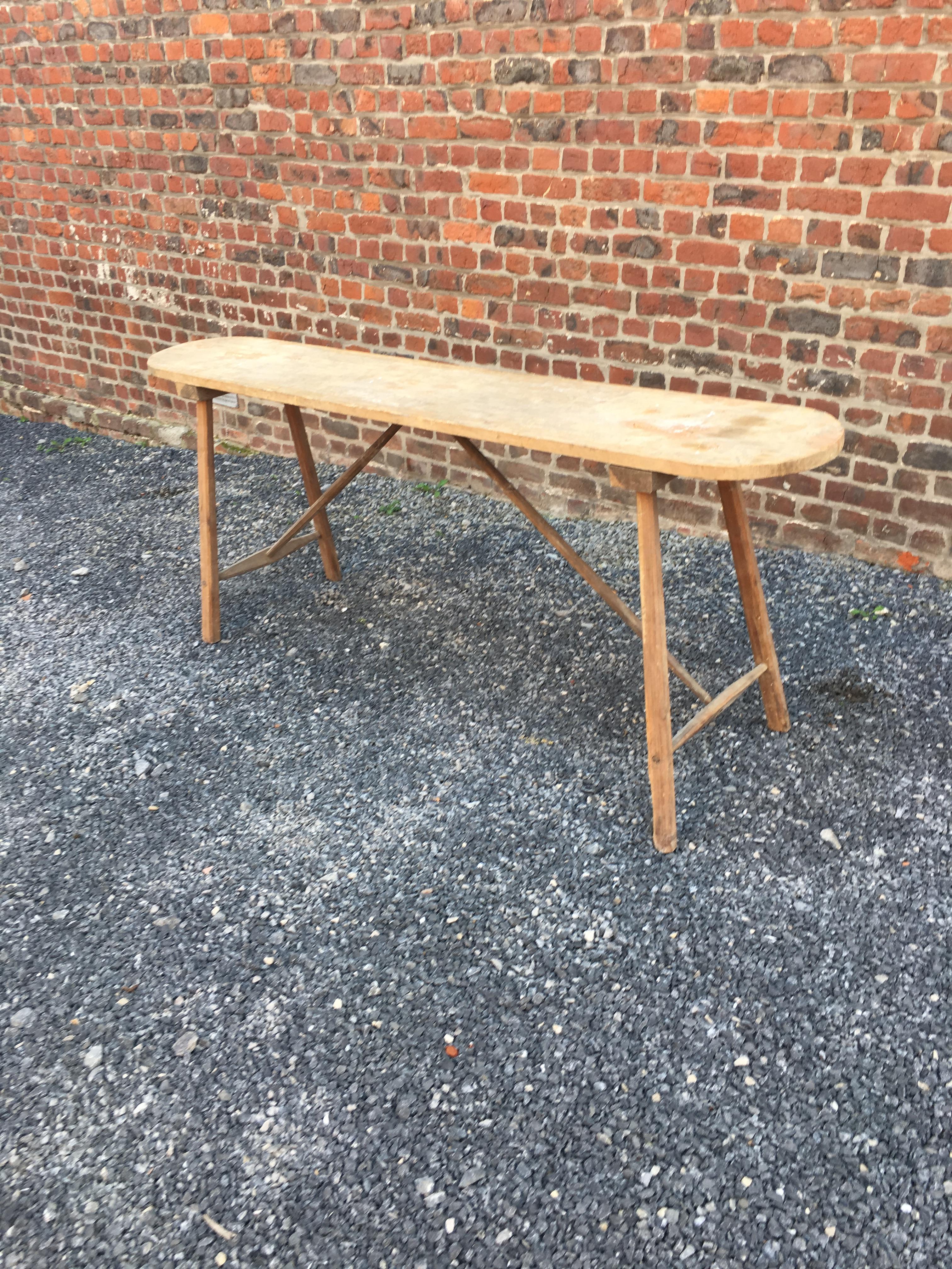Brutalist wooden console table, circa 1930.
Old washerwoman's table.