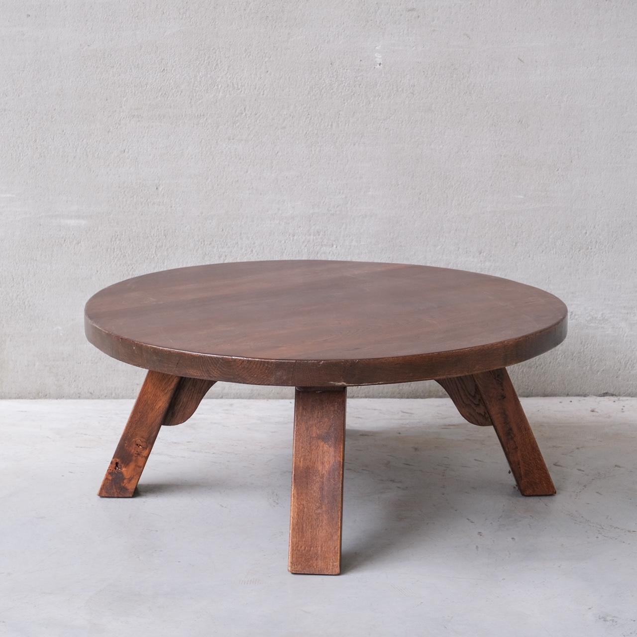 A four legged chunky wooden (likely oak) coffee table.

Holland, c1970s.

Good vintage condition, some scuffs and wear commensurate with age.

Internal Ref: 5/9/23/003.

Location: Belgium Gallery.

Dimensions: 108 Diameter x 45 Height in