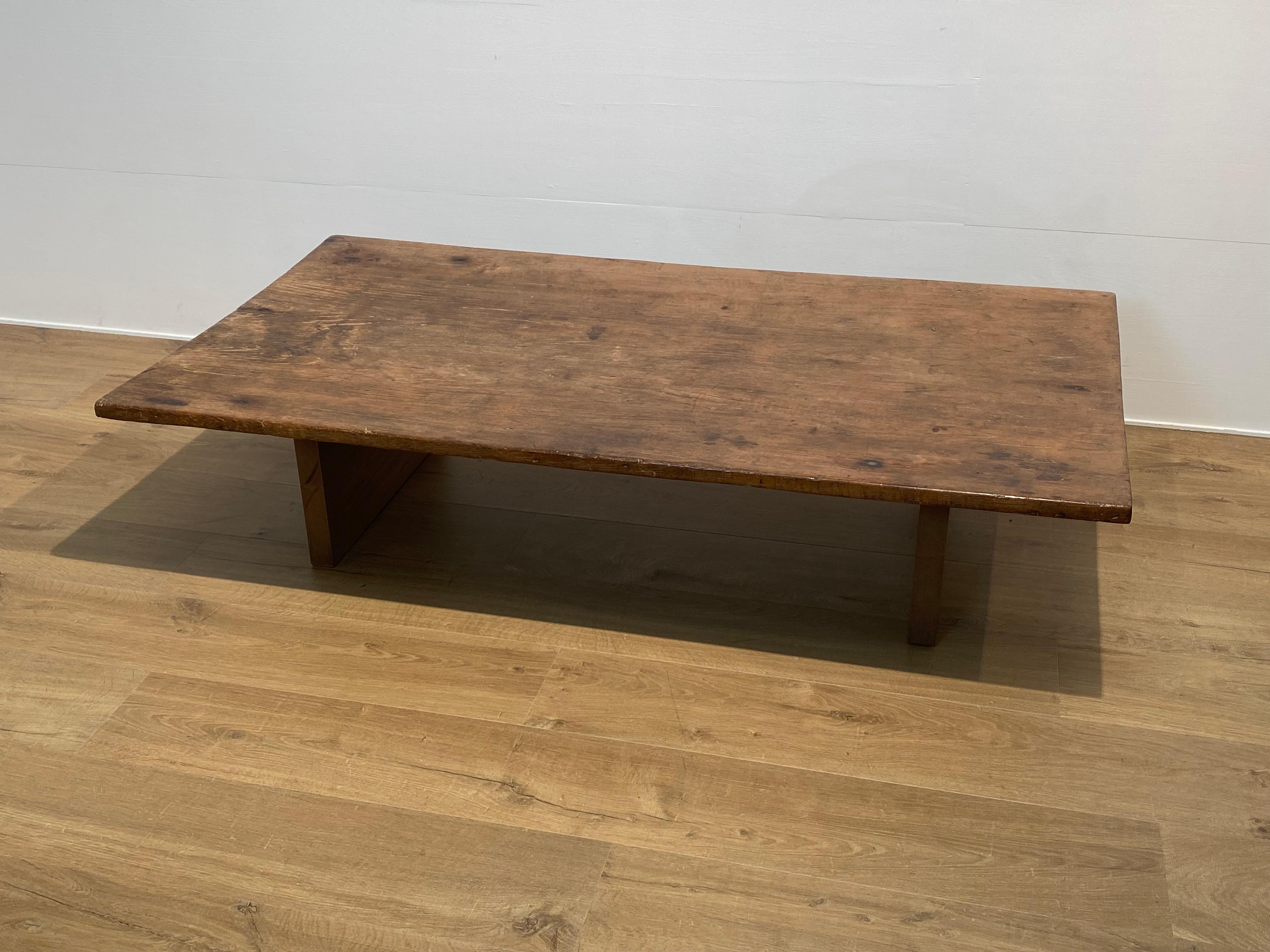 Brutalist Wooden Sofa Table,
made of an antique Teak wooden top from South East Asia, Thailand,
the base is a modern wooden structure,
the top is made of one piece wood and has a great patina and warm shine of the wood,
the top has a very light bow