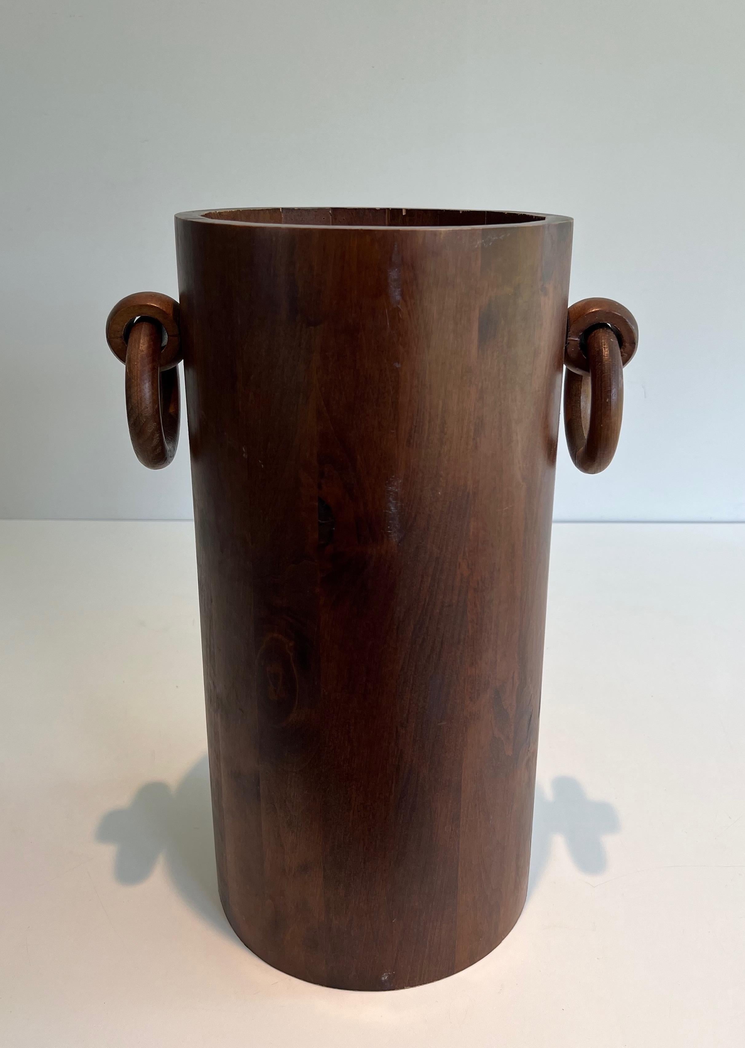 This brutalist umbrella stand is made of wood. The pîece has very simple and pure lines. This is a French work. Circa 1950