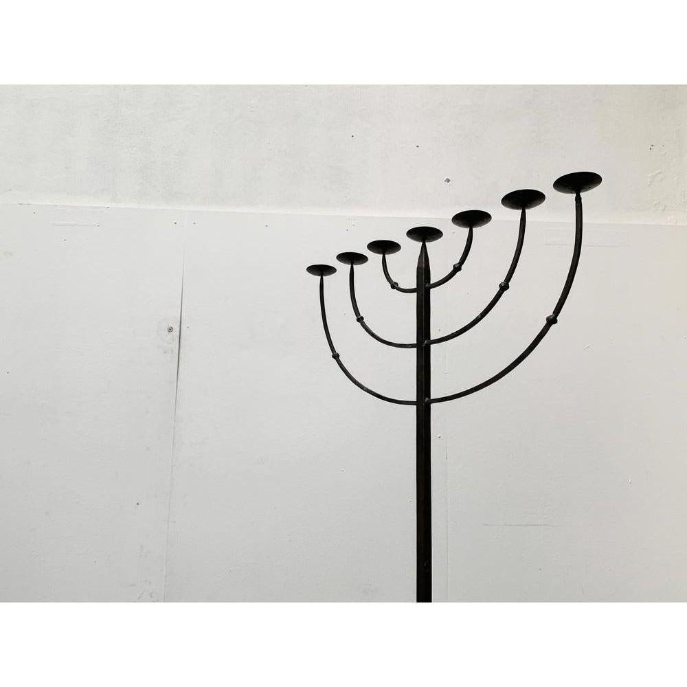 Large brutalist Candle Holder. Handmade from wrought Iron. 7 arms and tripod foot..

Additional information:
Material: Metal
Color: Black
Styles: Brutalist
Period: 1970s
Item Type: Vintage, Antique or Pre-owned
Diamension: 27.95ʺW ×