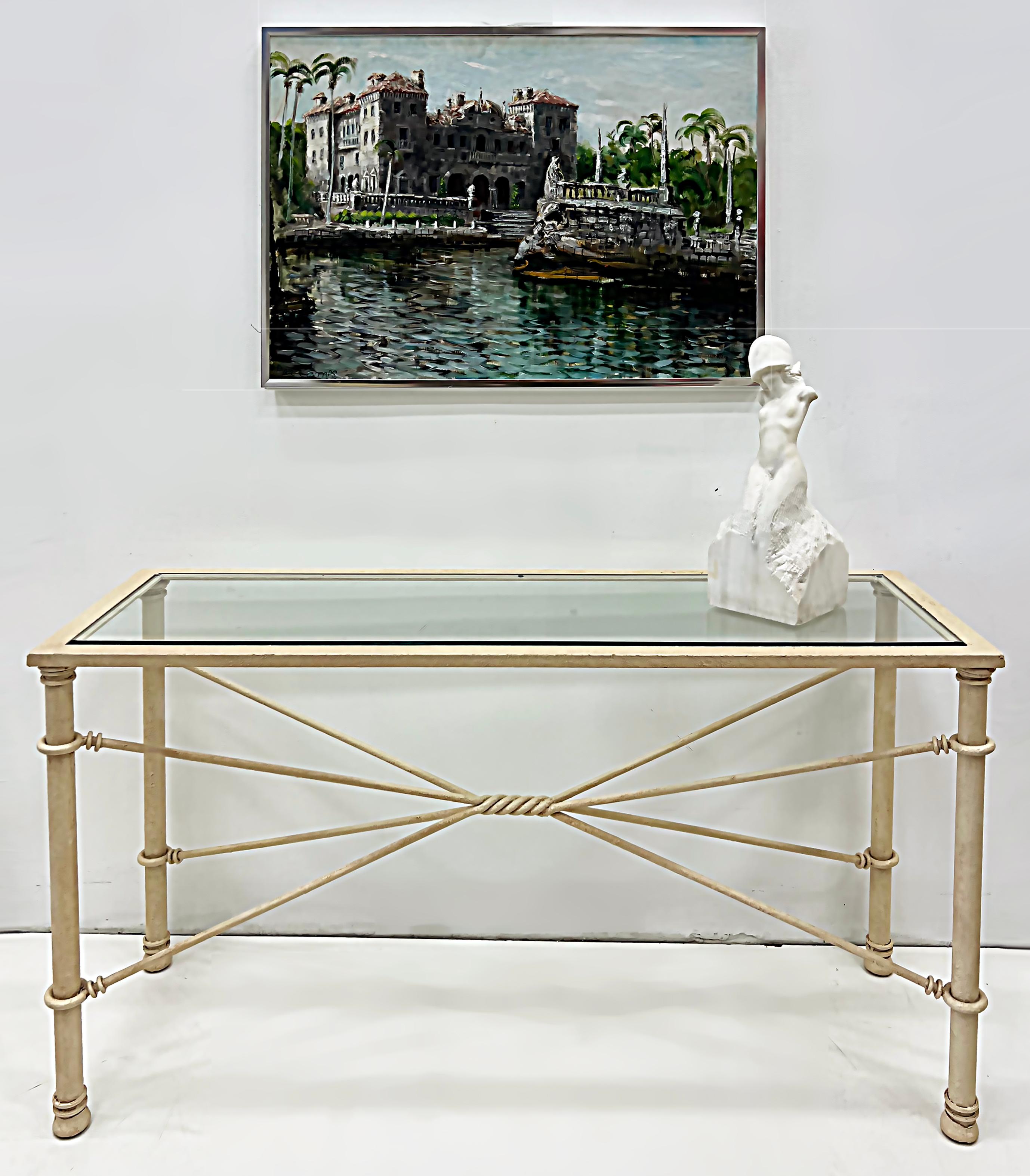 Brutalist Wrought-iron Console Table with Beveled Glass

Offered for sale is a 1980s John Dickinson style Brutalist wrought-iron console with an inset beveled glass top. The wrought-iron frame is quite substantial and has a lightly textured patina