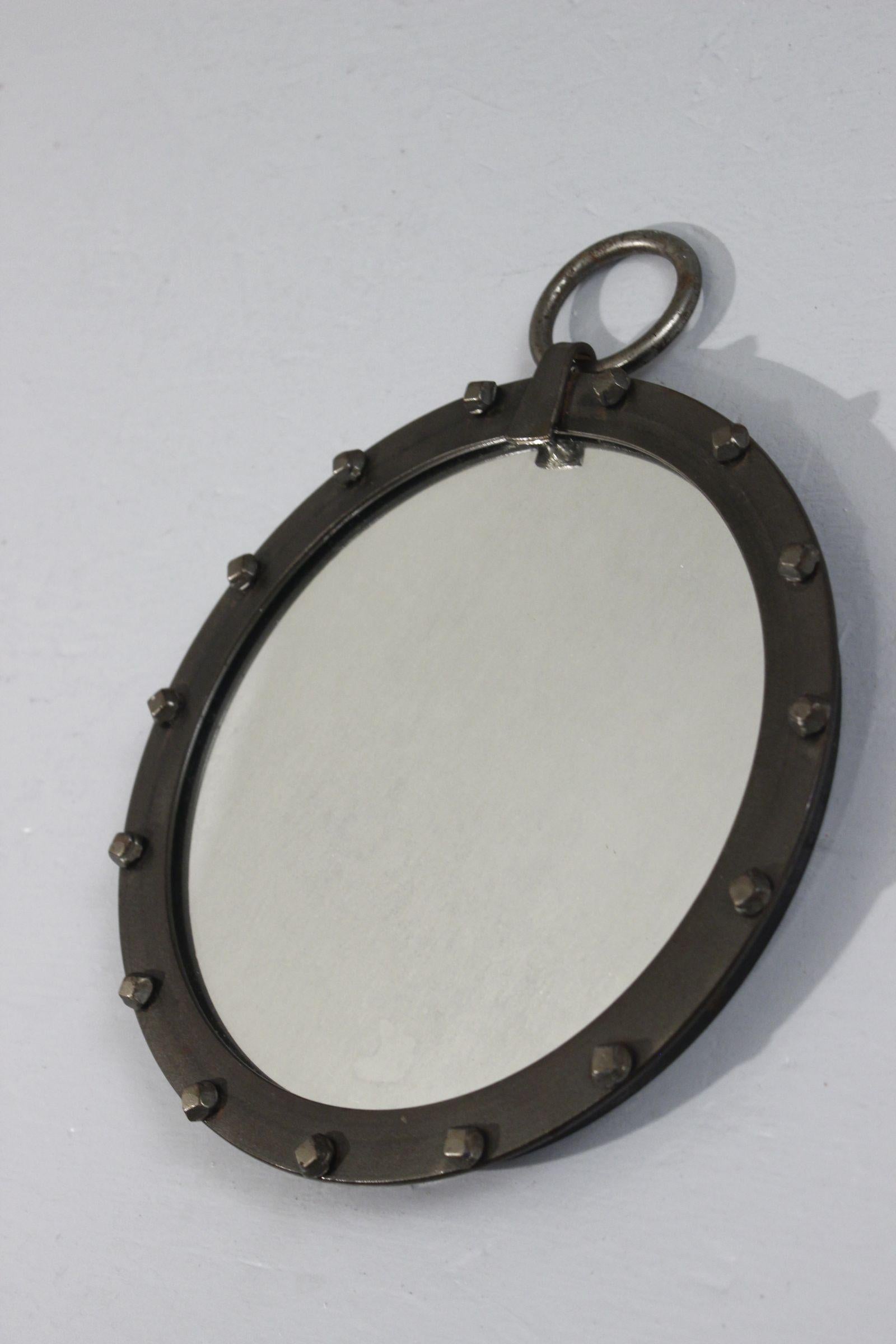 Beautiful round mirror with ring hook, French provincial ironwork circa 1950

In very good condition, with well-preserved sheen