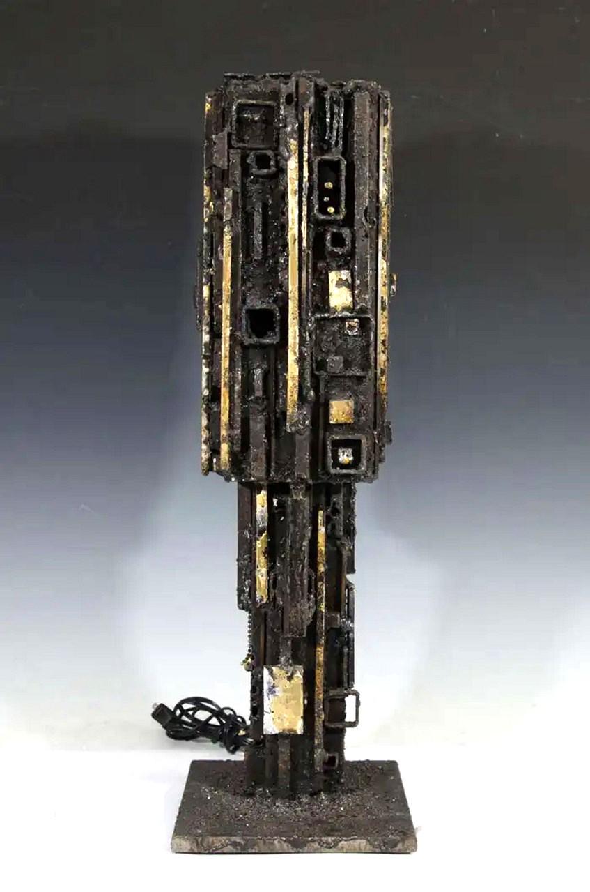 American Brutalism
In the Style of 
Paul Evans 
Sculptural Table Lamp
Wrought Iron 
Circa 1970s
DIMENSONS
Height: 26 in (66.04 cm)
Diameter: 8 in (20.32 cm)

CONDITION
Good vintage condition; newly rewired; age-related wear and surface