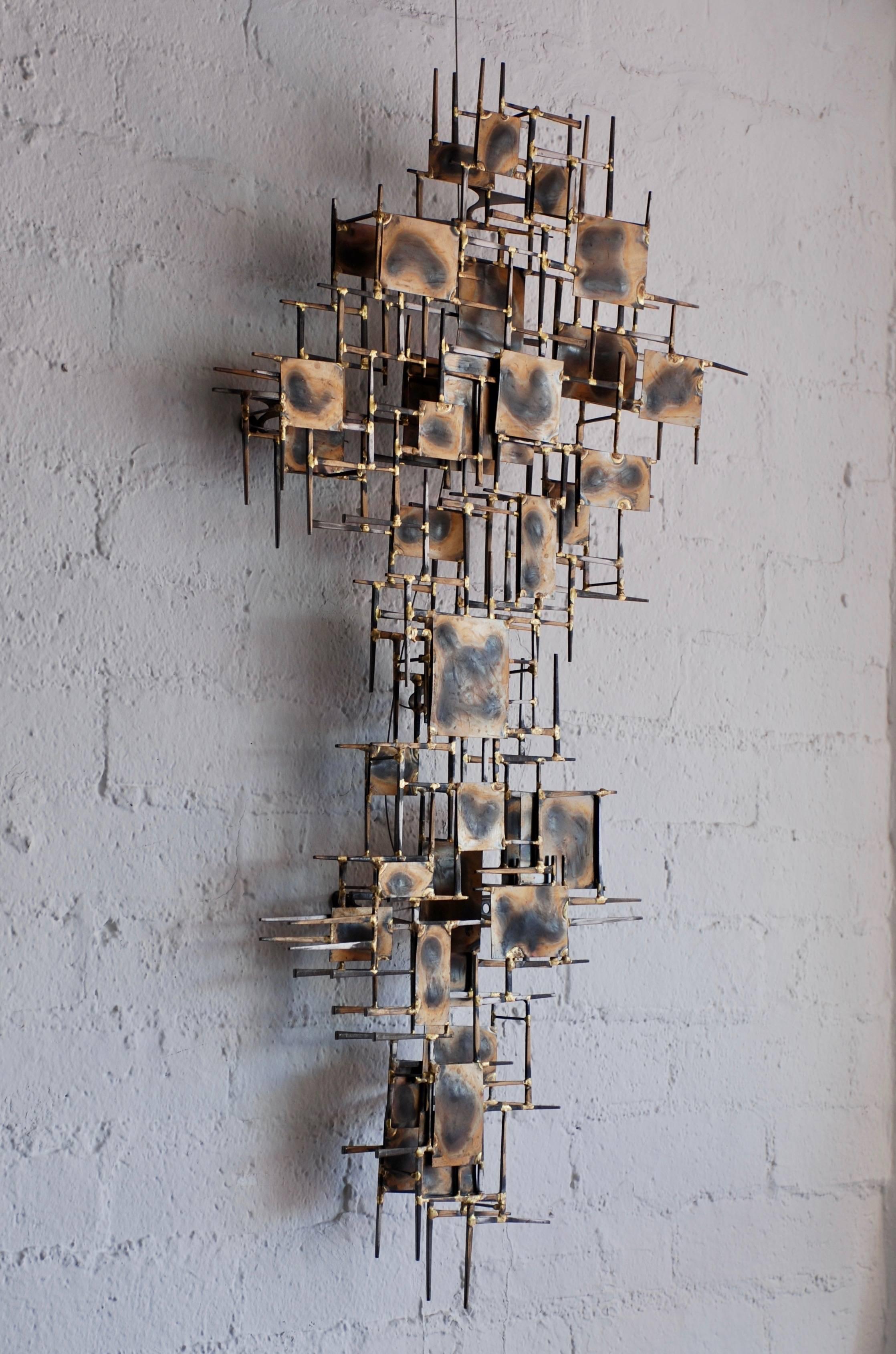 A vintage brutalist metal nail art wall sculpture by Marc Creates. The torch cut squares and rectangles have a nice brass patina. The sculpture can be hung horizontally or vertically.