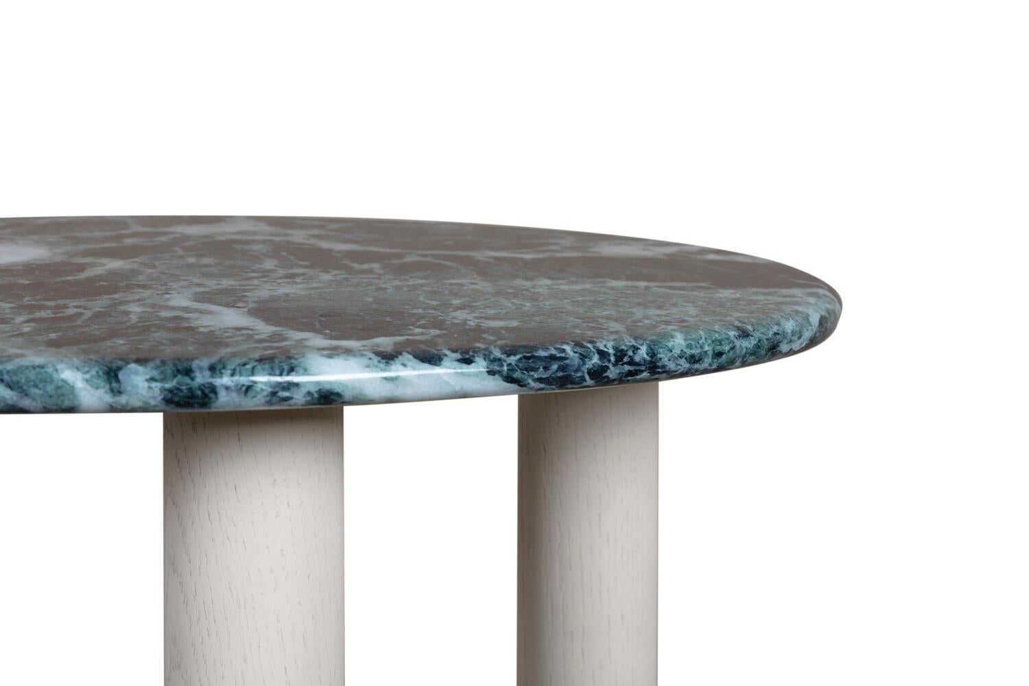 The beauty of the Bruton side table lies in the exquisite detail. The solid Verdi Alpi marble top has a wonderful irregular shape, and is finished with a bull-nose edge which echoes the organic lines of the leg. The warmth of solid oak works in