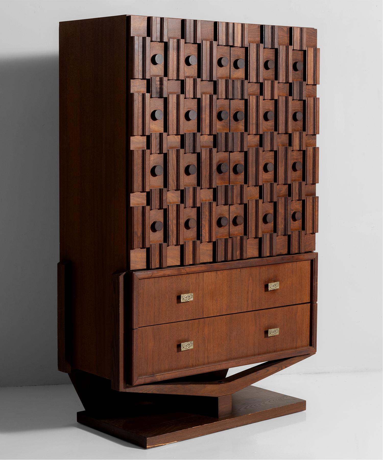 Raised on arched plinth with circular and beveled sculpted wood elements on side cabinet doors. Cast iron brutalist pulls.


