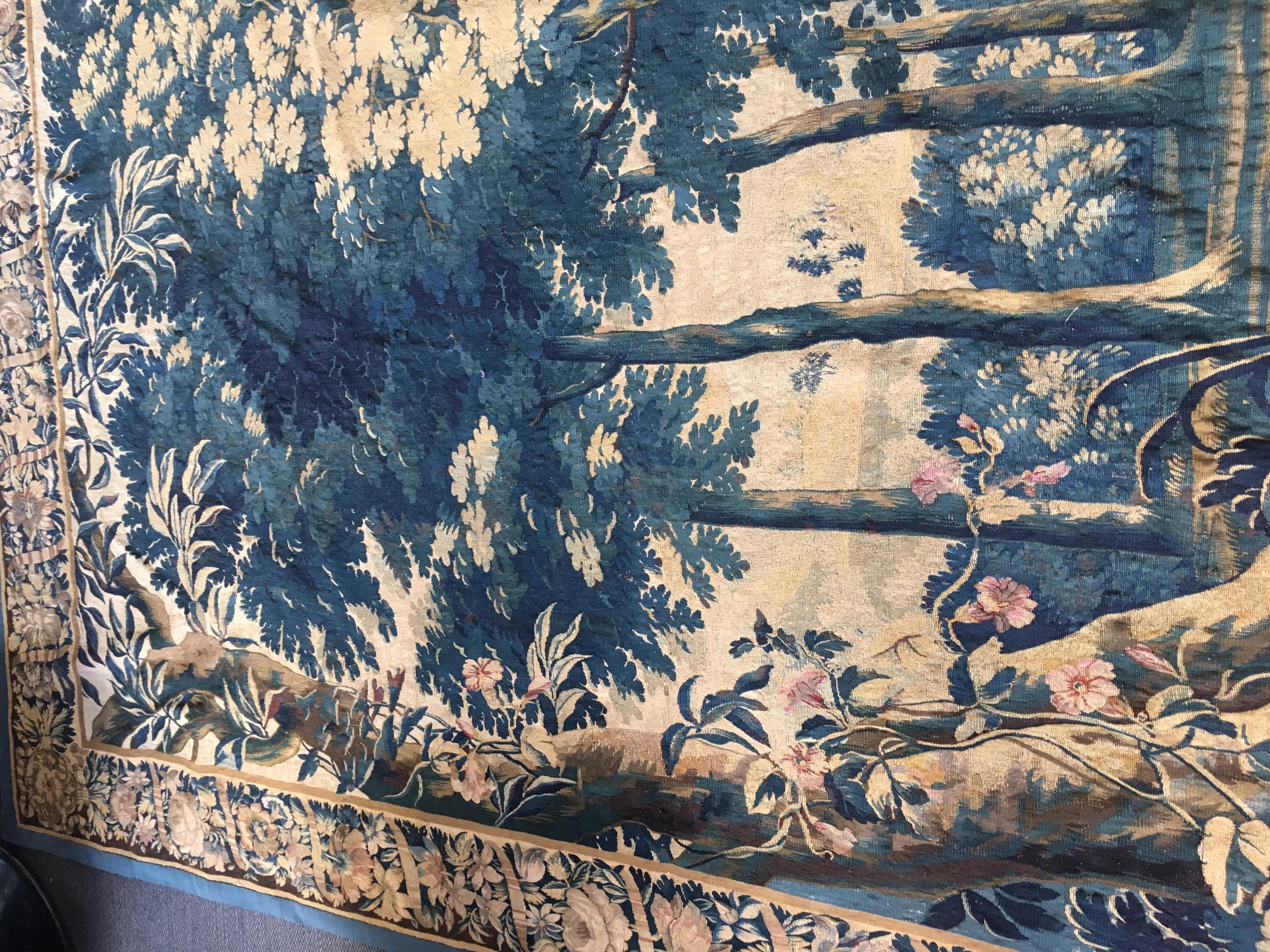 Bruxelles manufactured, early 18th century - 
Wool and silk
Elaborated foliage border with interlaced with pink ribbon design -
Lined
Excellent condition considering age.
 