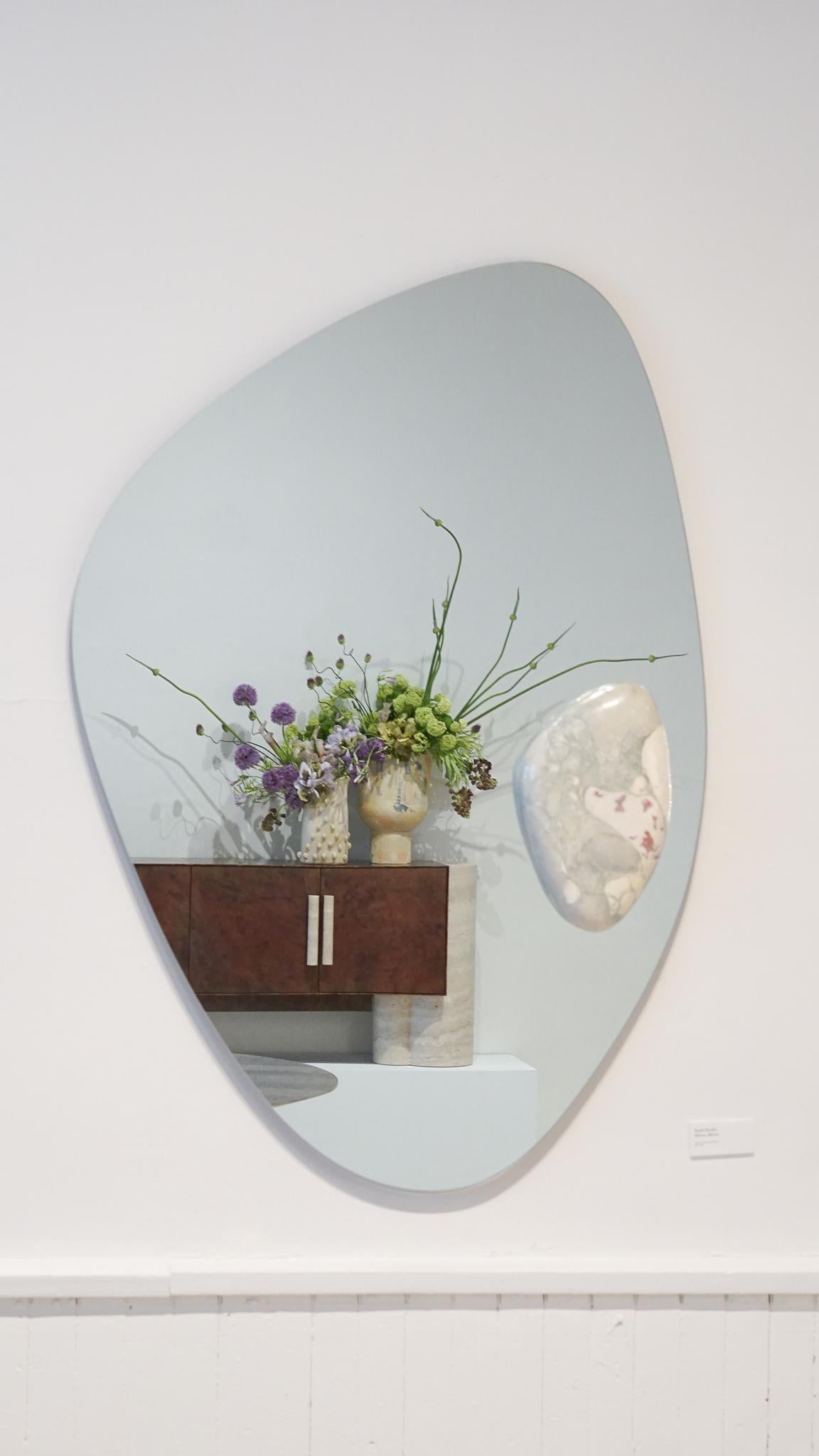 Bryce mirror by Swell Studio.
Dimensions: D3 x W40 x H60 cm.
Material: clear mirror, Breccia Stazzema.


The Bryce mirror is an exploration of organic forms and how two materials can interact. A hand sculpted stone mount effortlessly floating