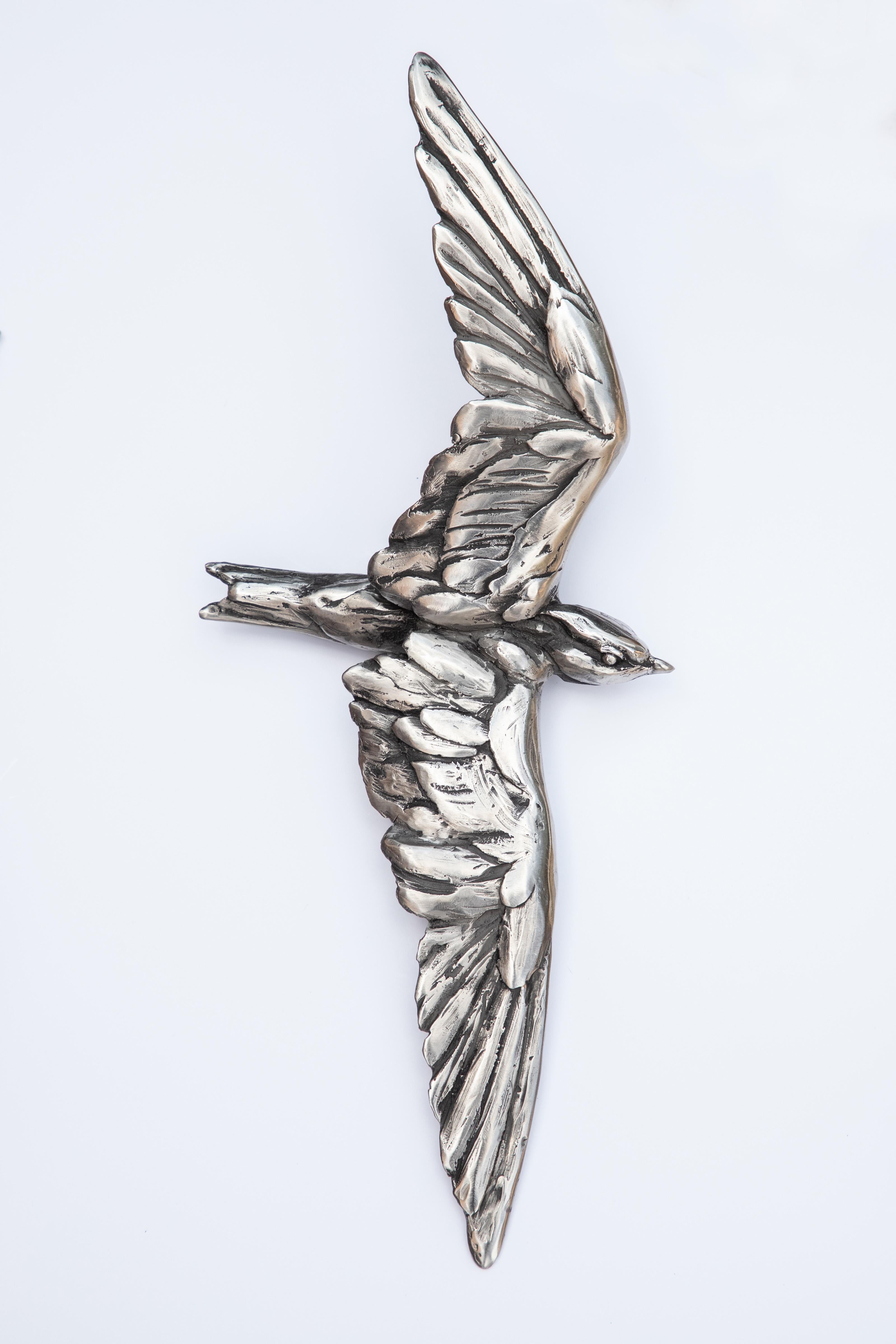 Stainless Steel sculpture with an inscribed signature and edition number by the Artist on the base of the piece.
24/30