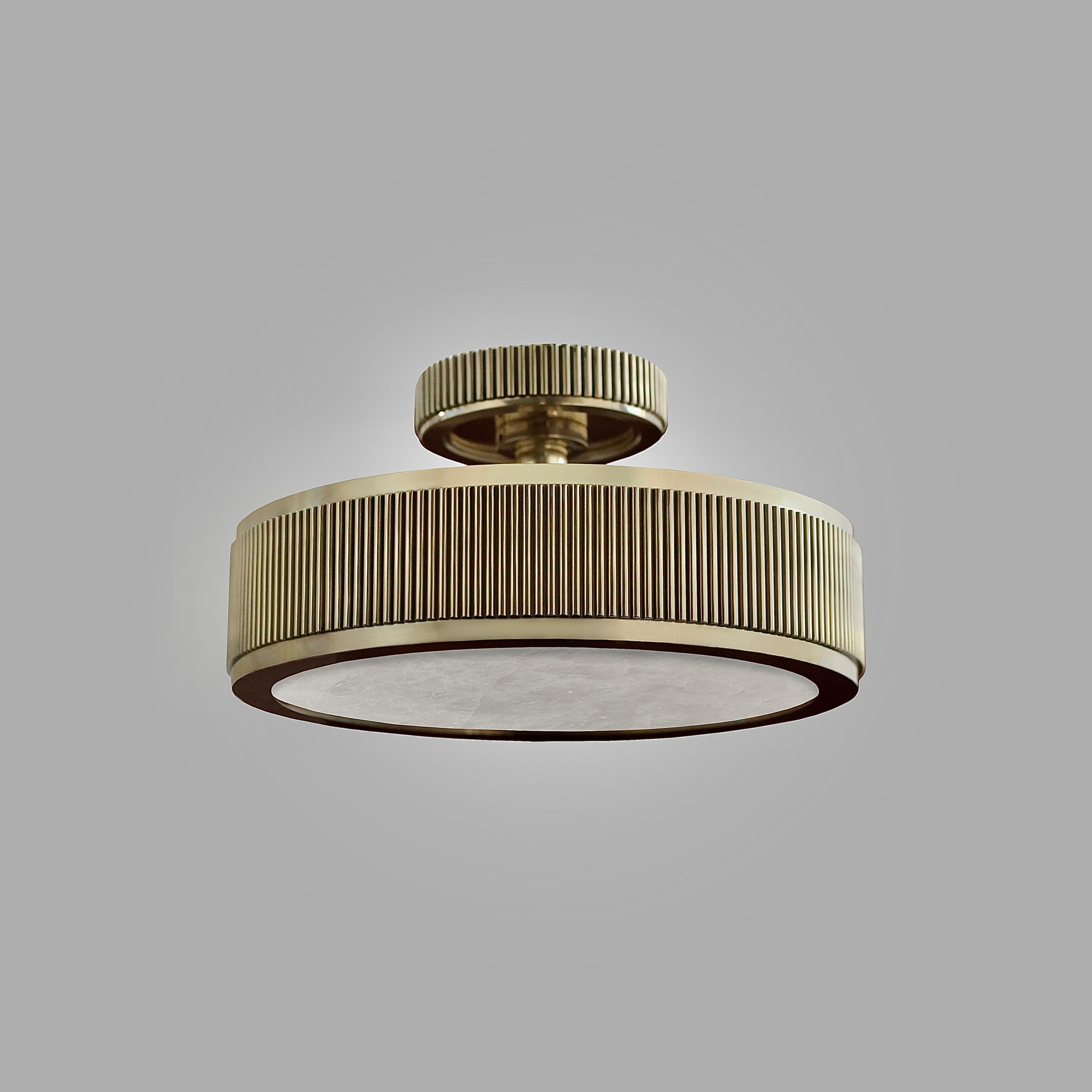 Elegant form semi flushmount with polished brass finish and rock crystal panel.3 E12 sockets installed.
180w total.
Created by Phoenix 
Custom metal finish upon request.

