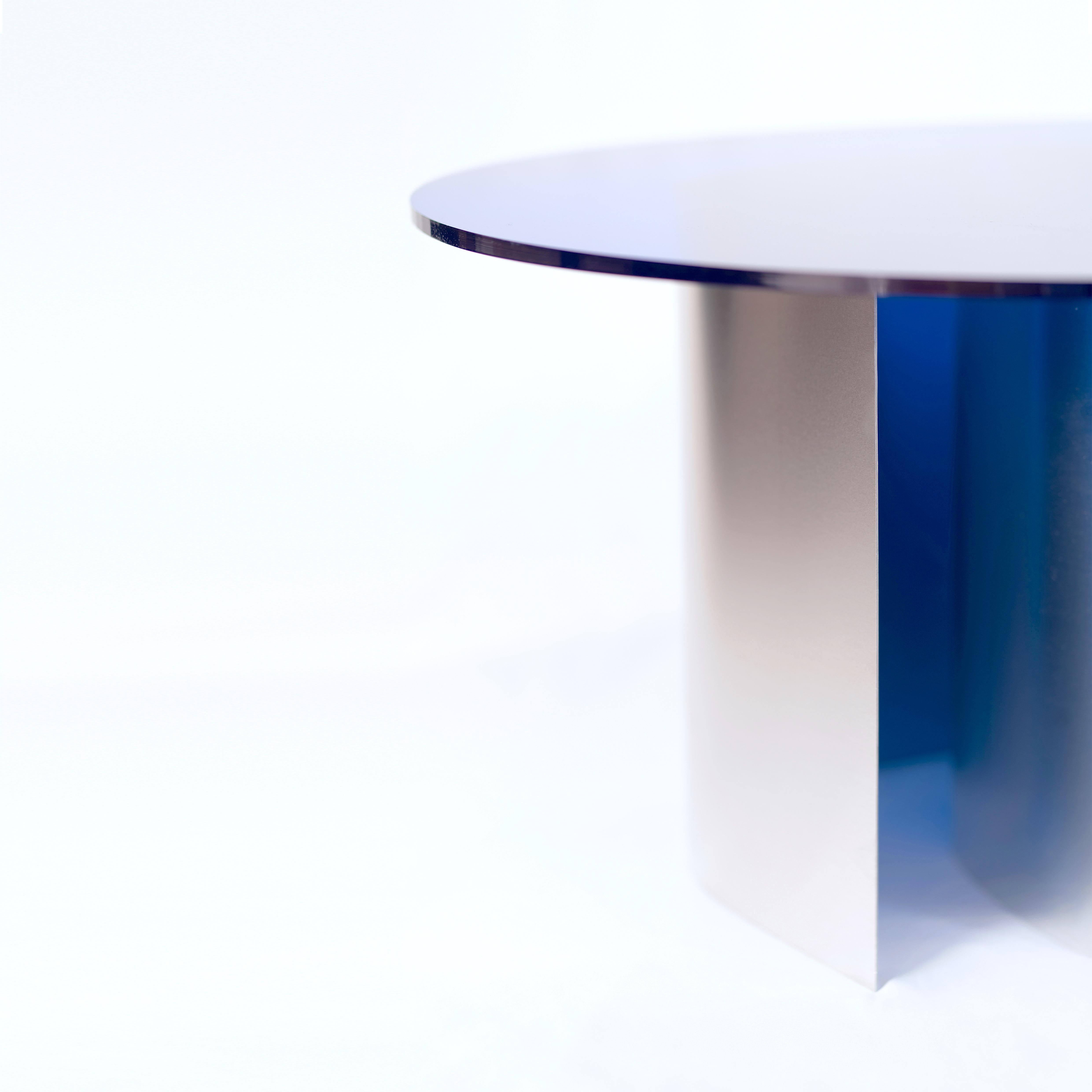 BT01 is a coffee table characterised by simple and pure shapes. A sculptural/functional object realized by a unique shaped-by-hand aluminum base and a round colourful PMMA top. The designer, operating as a sculptor, directly interacts with