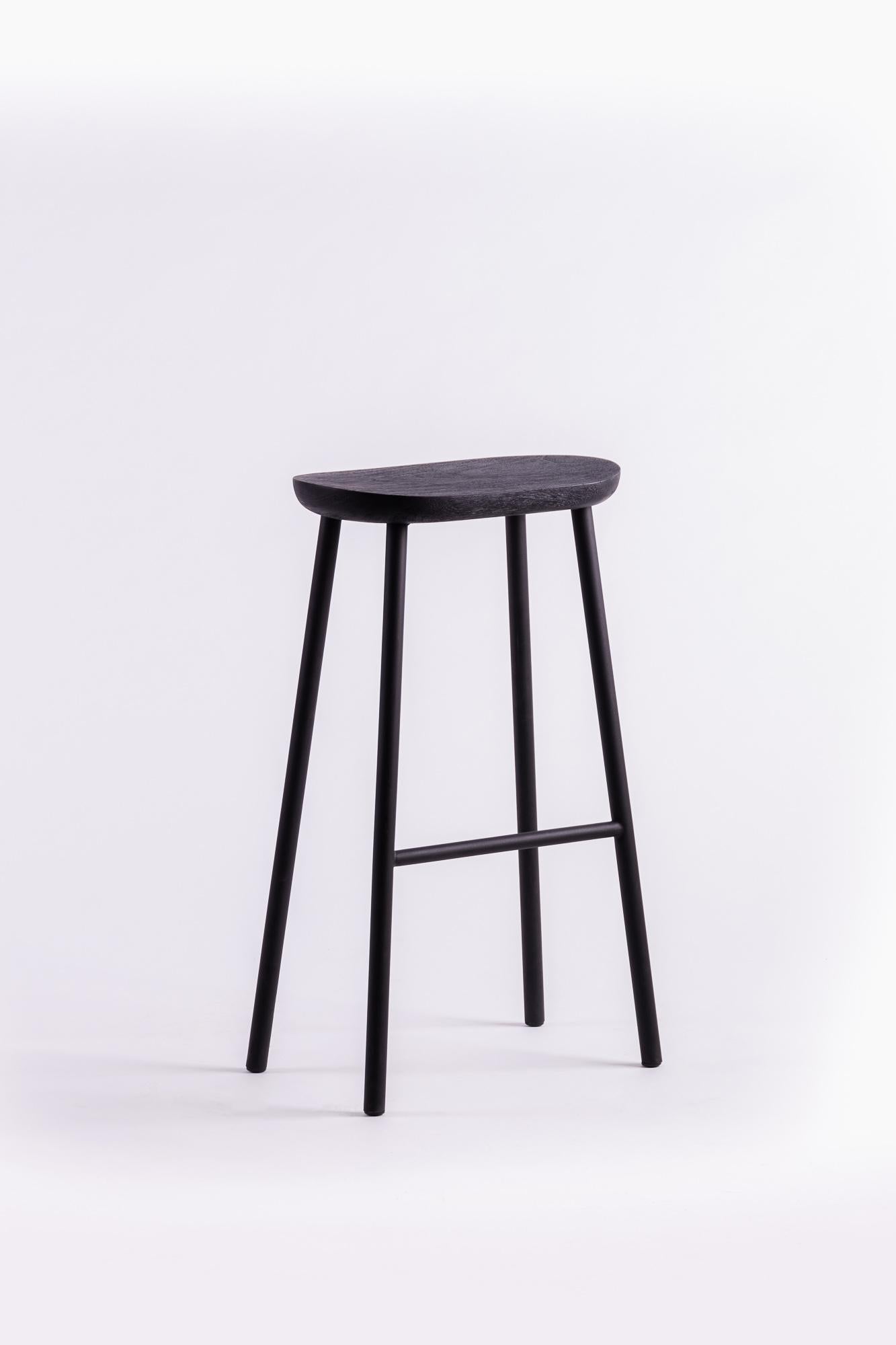 A minimal, humble stool stripped down to its essential structure. Material characteristics are honored with the fusion of wood and metal. With legs kept visually clean, this object blends in with your living space, creating absolute, long-lasting