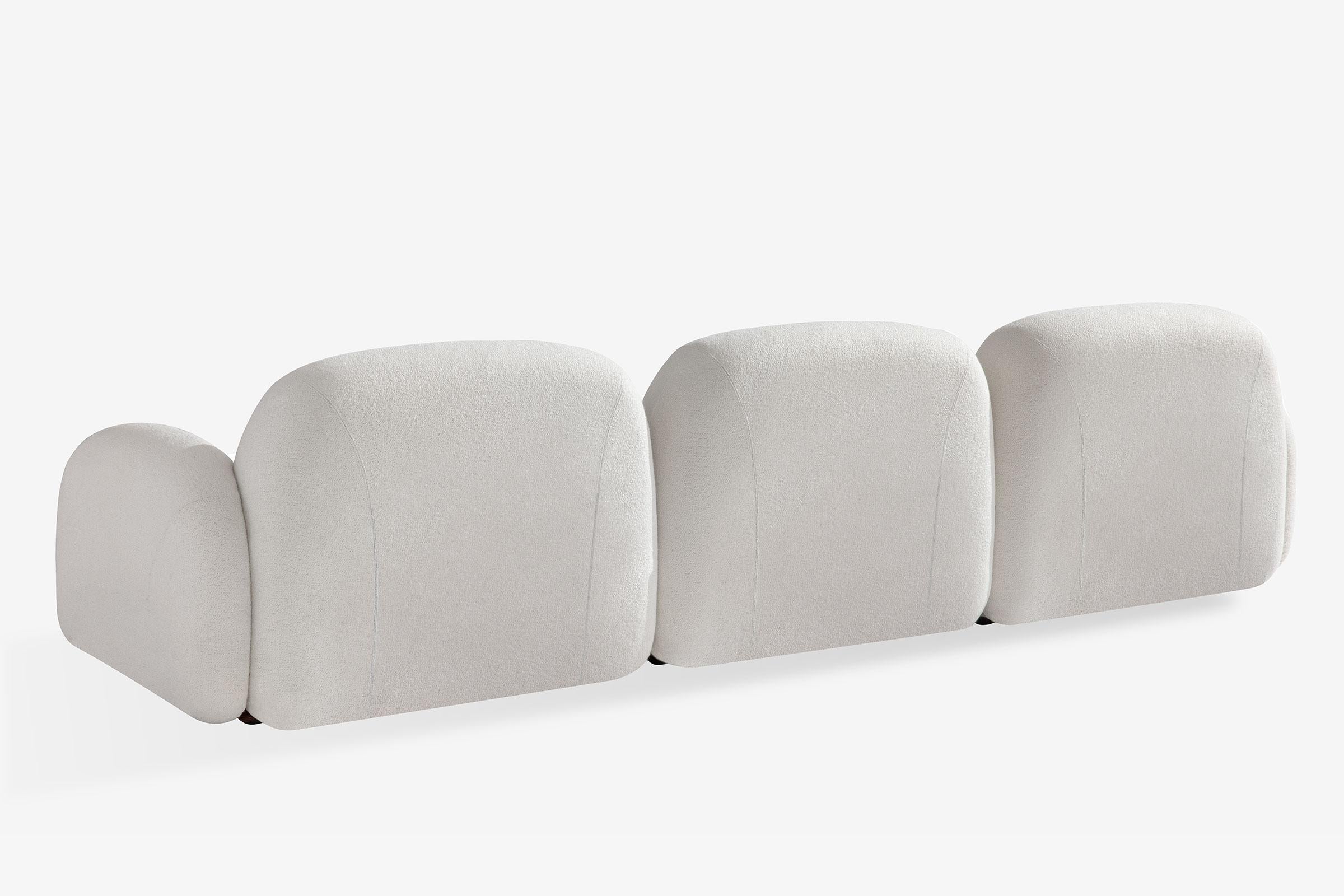 Three-seater upholstered sofa with or without curves and wooden base. Structure in EPA certified plywood, fir, hardboard. Padded with open-cell polyurethane and Dacron layers, sprung with elastic straps. Curved in layers of ash-veneered beech wood.