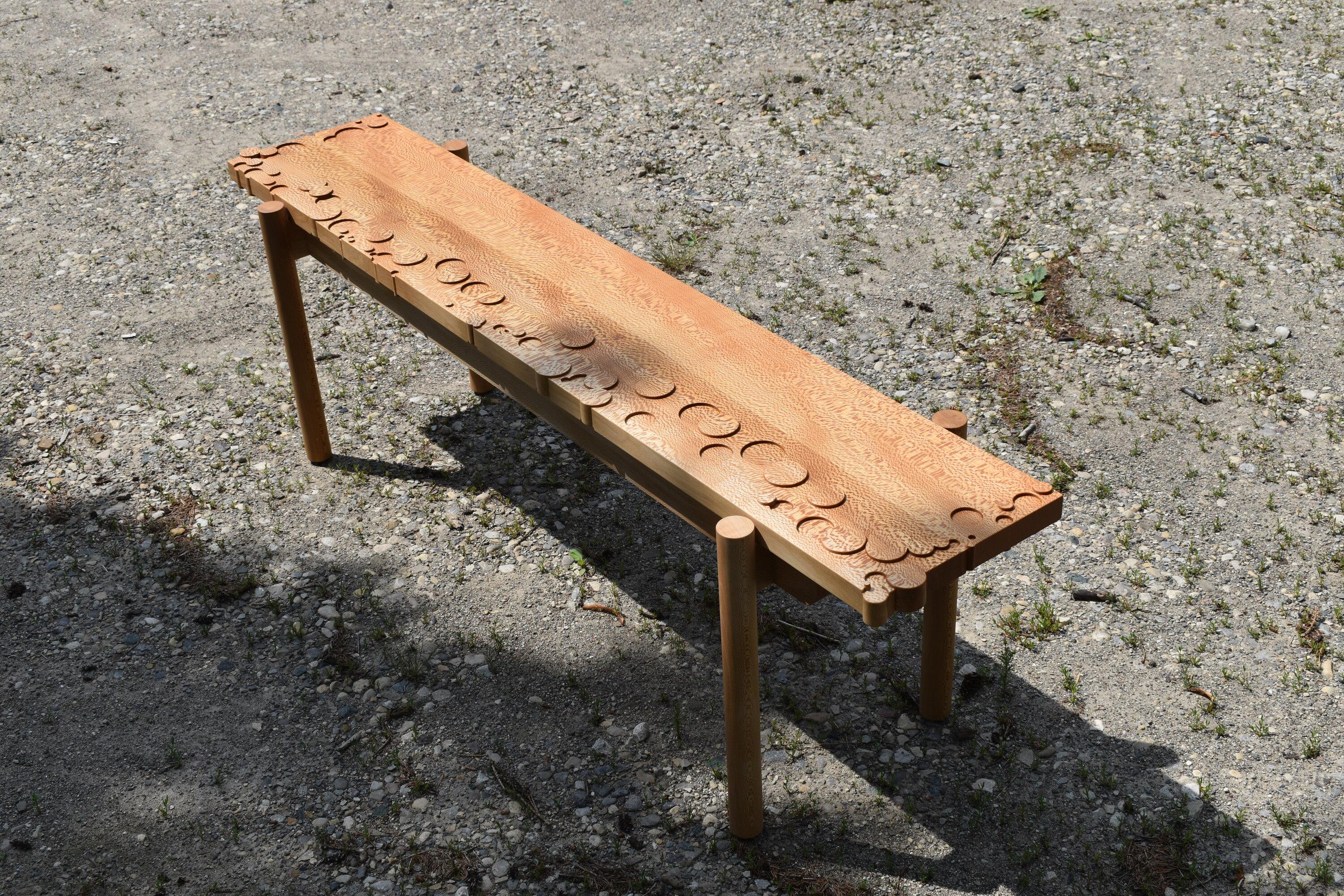 Carved quartered sycamore bench with raised and lowered bubbles. Each bench has a unique handmade pattern. Handrubbed hardwax oil finish. Available in any species of wood and dimensions.

Manufactured by Davidson and Thomas Limited in Elmira,