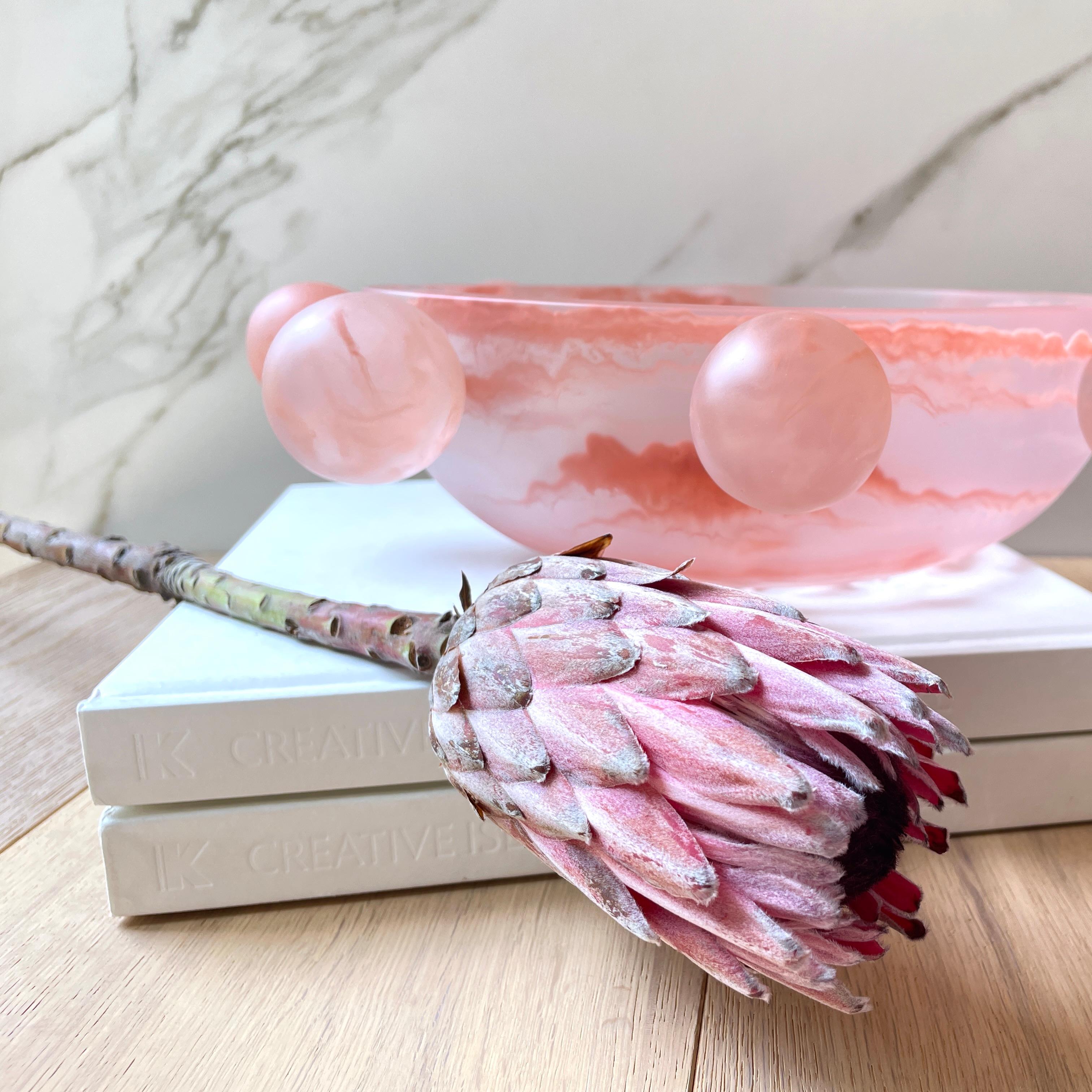 Our Bubble Bowl is handmade in marbled light pink resin. Its modern, fun and unique design makes it a statement piece and can be used as decor or as a fruit platter.

Designed by Paola Valle and manufactured in Mexico City by extraordinary artisans.