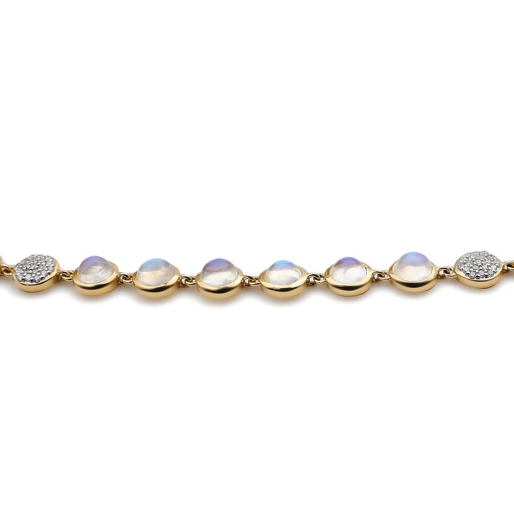 Our Bubble Diamond and Moonstone Necklace features an assortment of luminous moonstones set within a thin bezel frame and illuminated by stations of sparkling petite white diamond clusters positioned randomly along the strand. The necklace measures