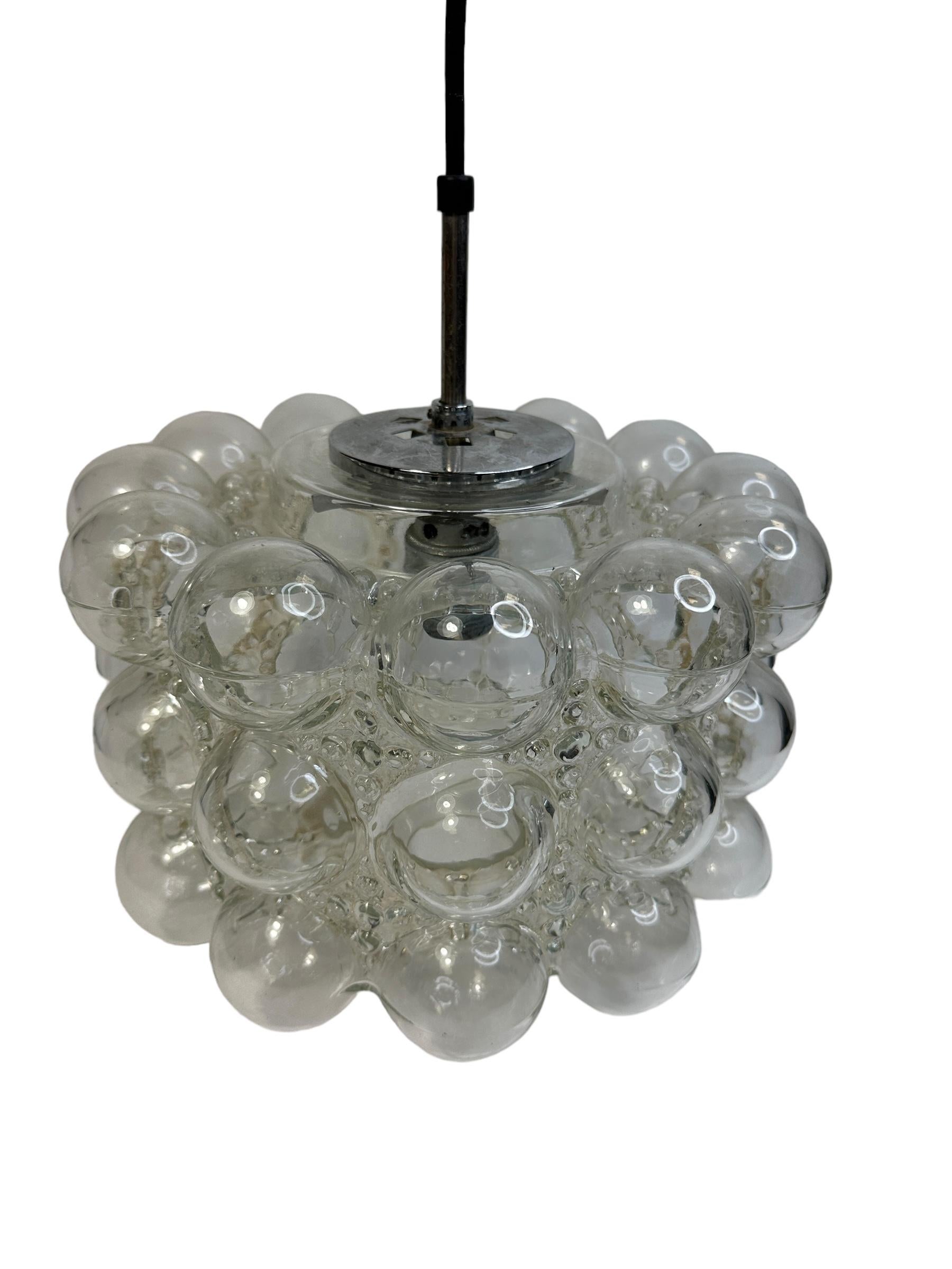 A stunning bubble glass pendant designed by Helena Tynell and Heinrich Gantenbrink for Glashütte Limburg, manufactured in Germany, circa 1960s. The Pendant requires one European E27 Edison bulb, up to 100 watts. A nice addition to any room. Found at