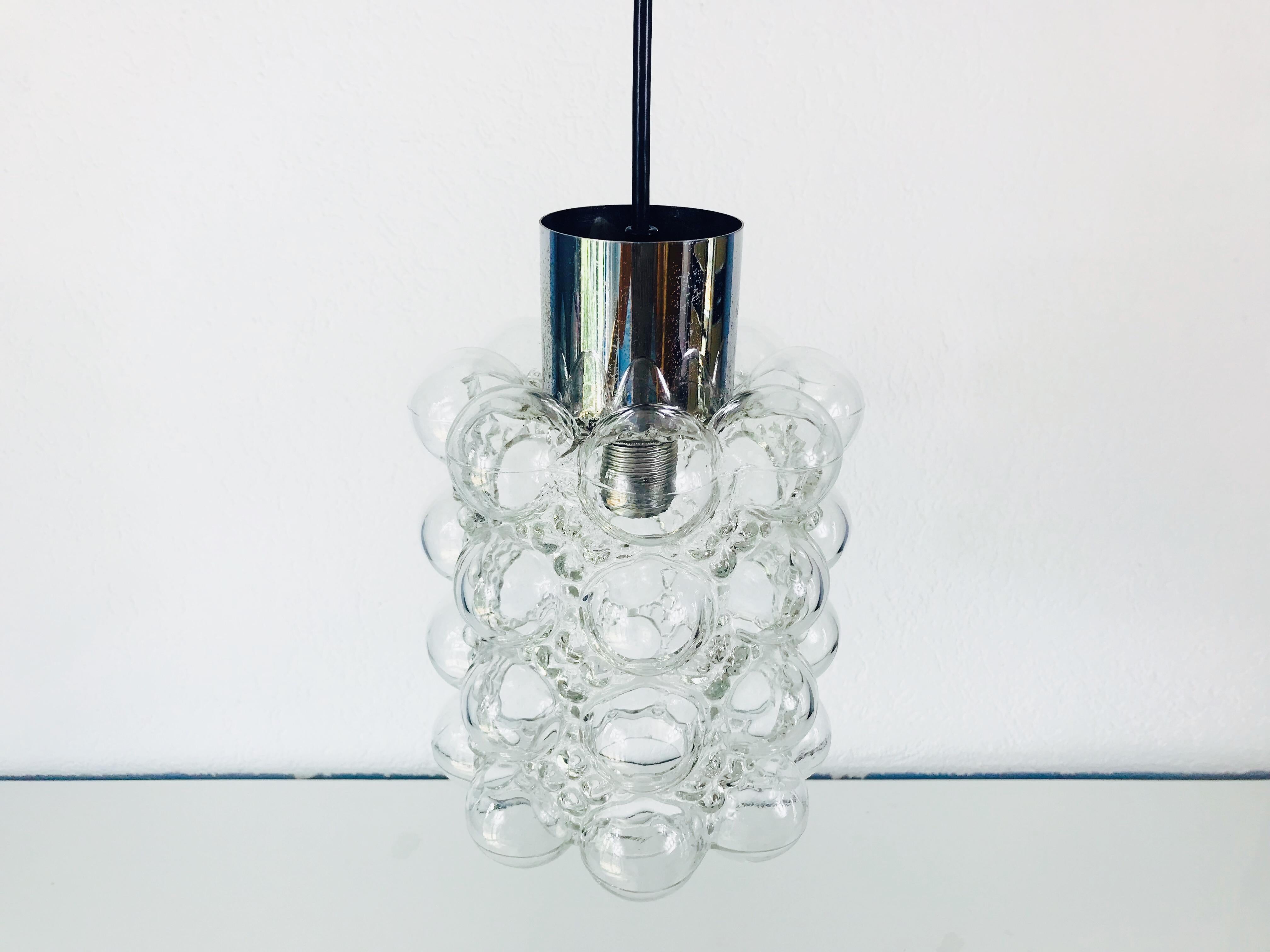 A bubble glass flush mount by Helena Tynell for Limburg made in Germany in the 1960s. Helena Tynell is a glass and ceramic designer who has worked for many European companies. One of her master works is this amber glass pendant lamp. It is