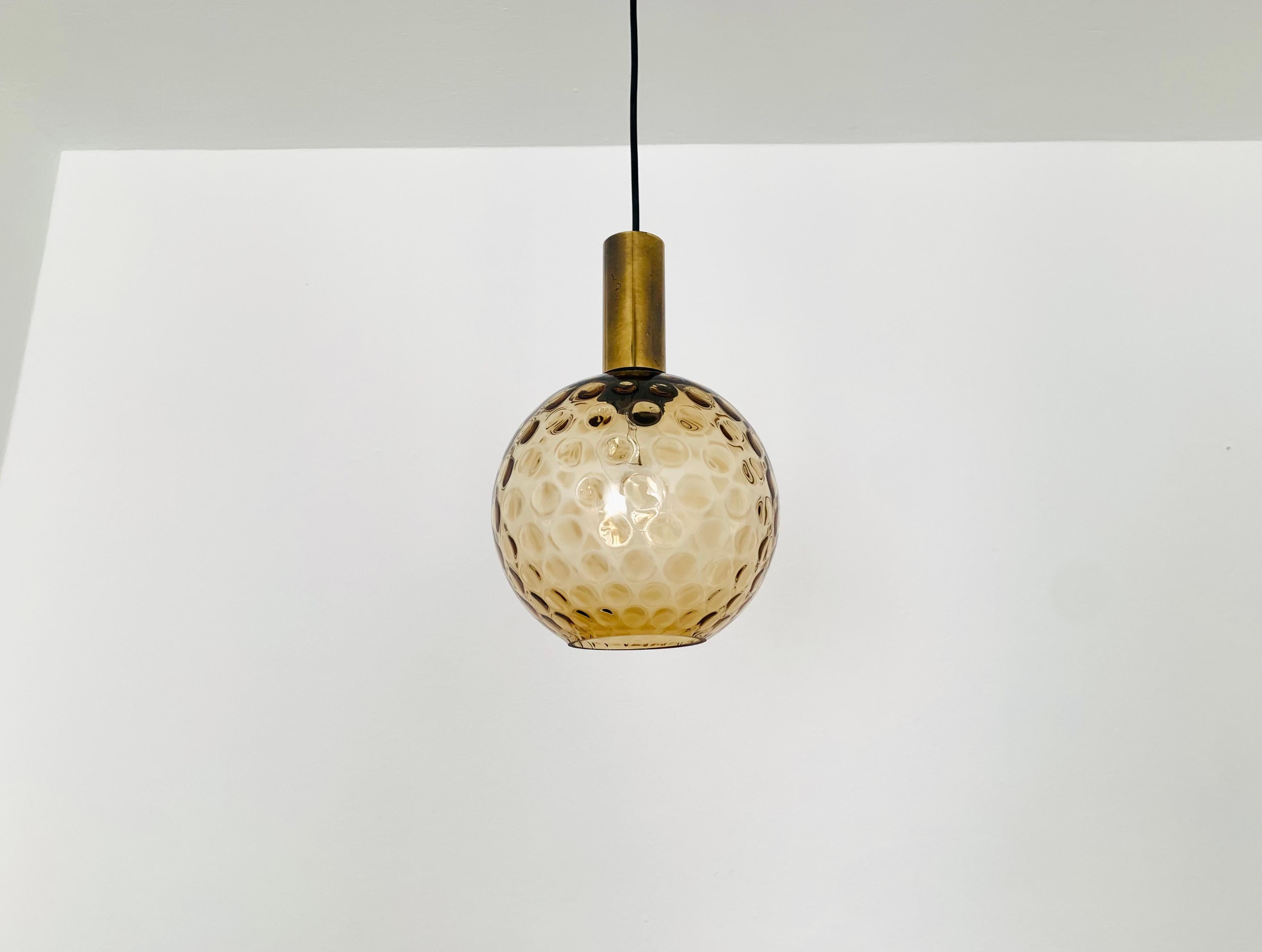 Wonderful bubble glass pendant lamp from the 1960s.
The lamp spreads a great play of light in the room and enchants with its charisma.
Great high-quality workmanship and extraordinary design.

Condition:

Very good vintage condition with slight