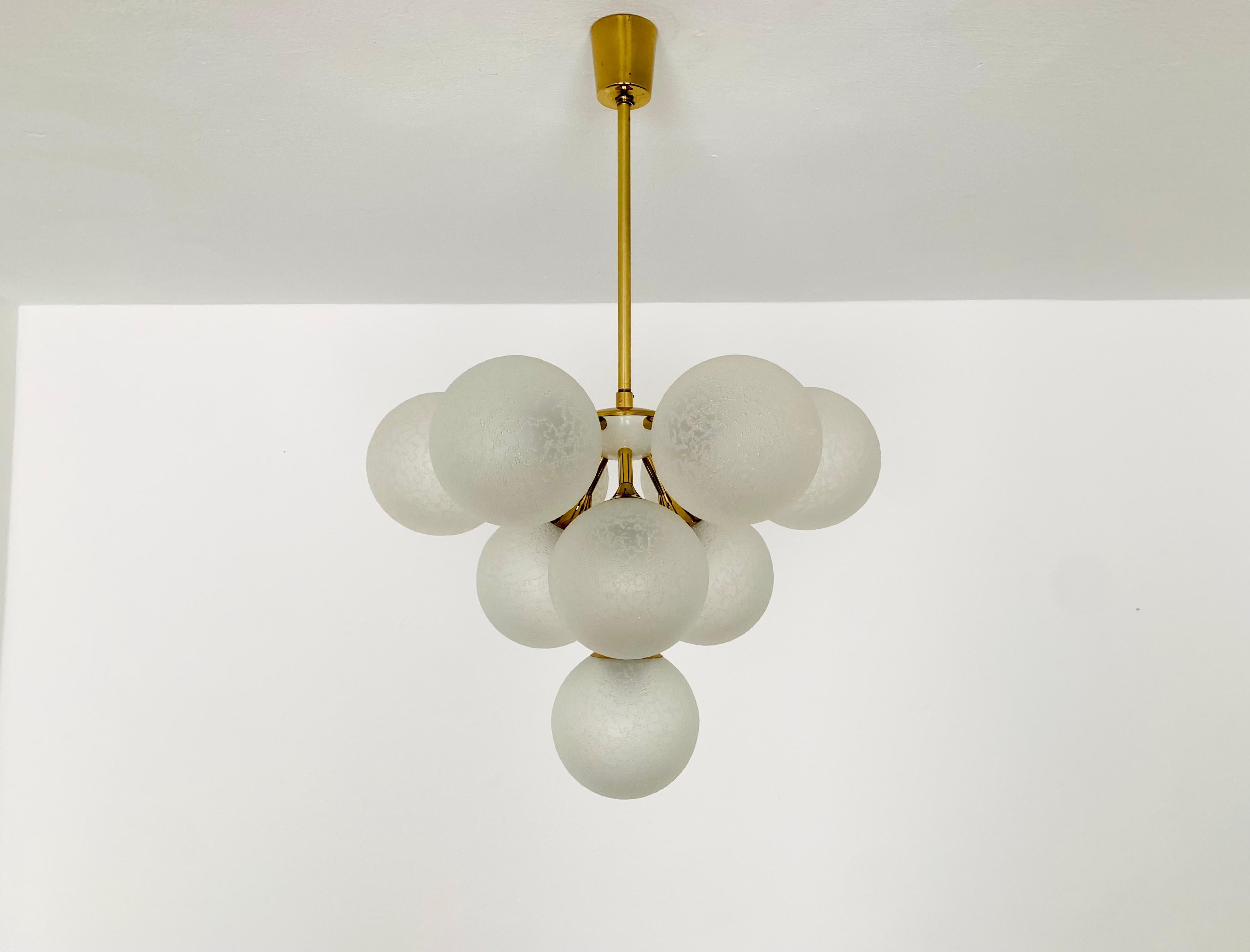 Extremely beautiful and rare Sputnik chandelier from the 1960s.
The 10 special lampshades spread a pleasant light.
The lamp has a very high quality finish.
Very contemporary design with a fantastic look.

Condition:

Very good vintage