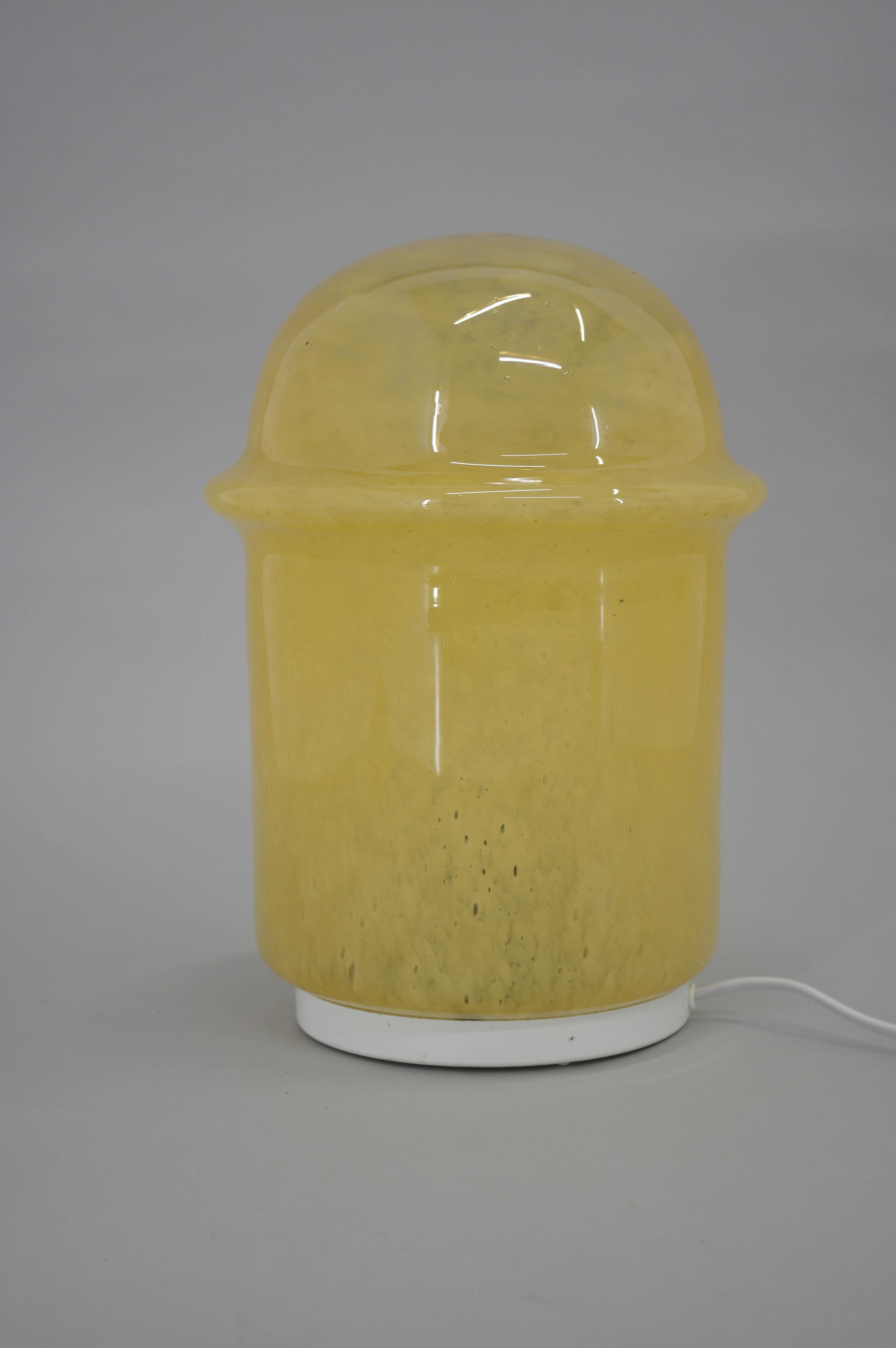 Space Age yellow glass table or floor lamp made in Czechoslovakia in 1970s. One crack on bottom part of glass (visible on photo) has no effect on function.
1x75W, E25-E27 bulb
US plug adapter included