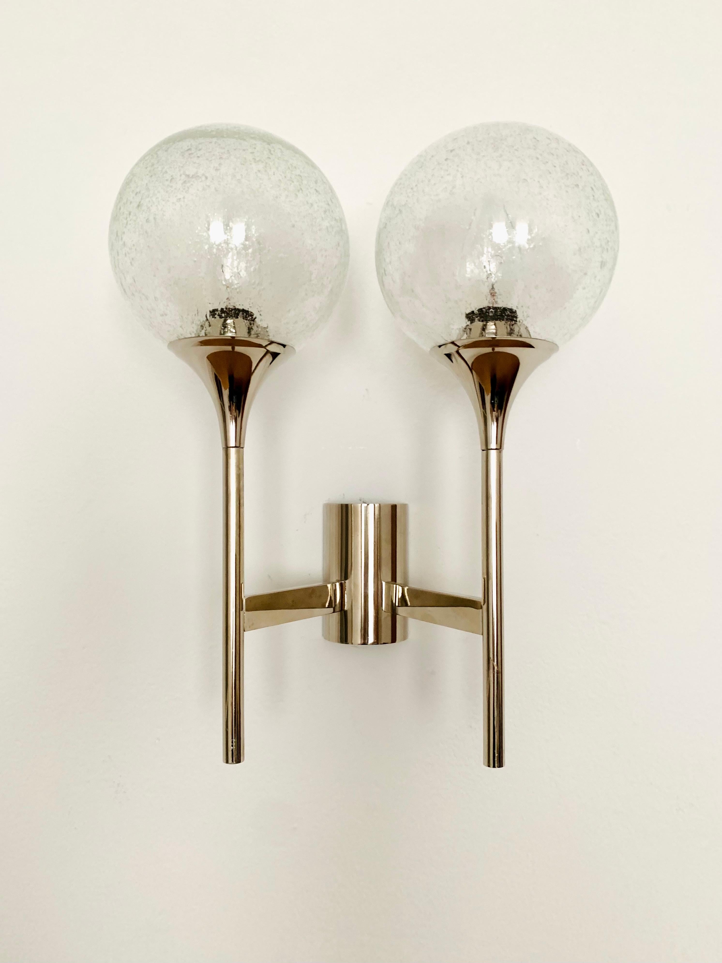 Beautiful Sputnik wall lamp from the 1960s.
The 2 bubble glass lampshades spread a sparkling light.
The lamp has a very high quality finish.
Very contemporary design with a fantastic noble appearance.

Condition:

Very good vintage condition