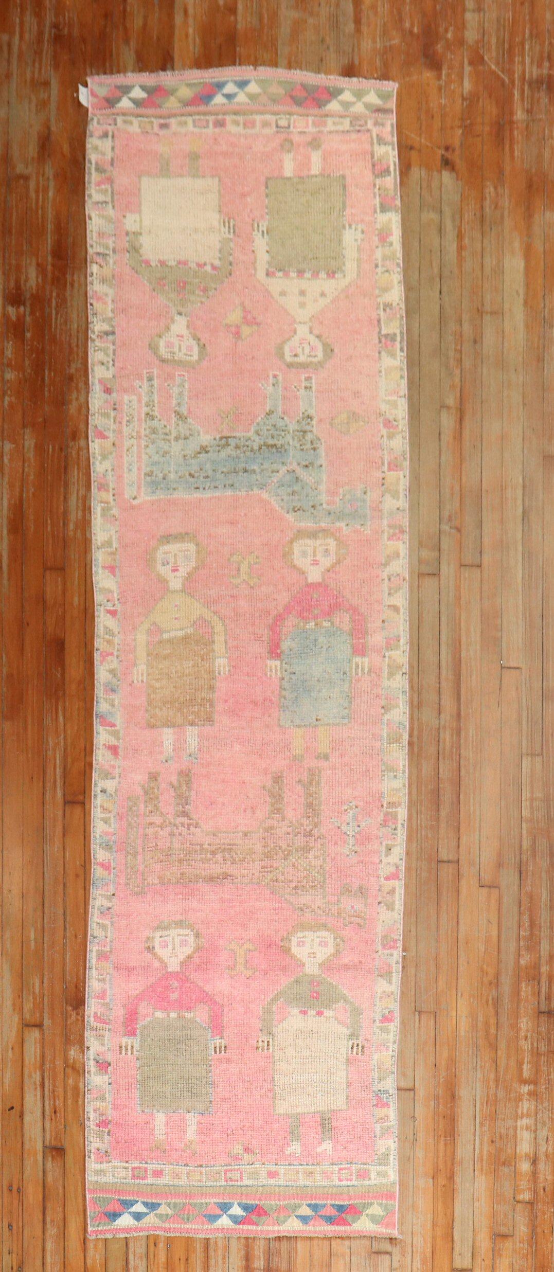 Mid-20th century Turkish Anatolian Runner featuring humans and animals on a bubble gum pink field.

Measures: 2'10'' x 11'