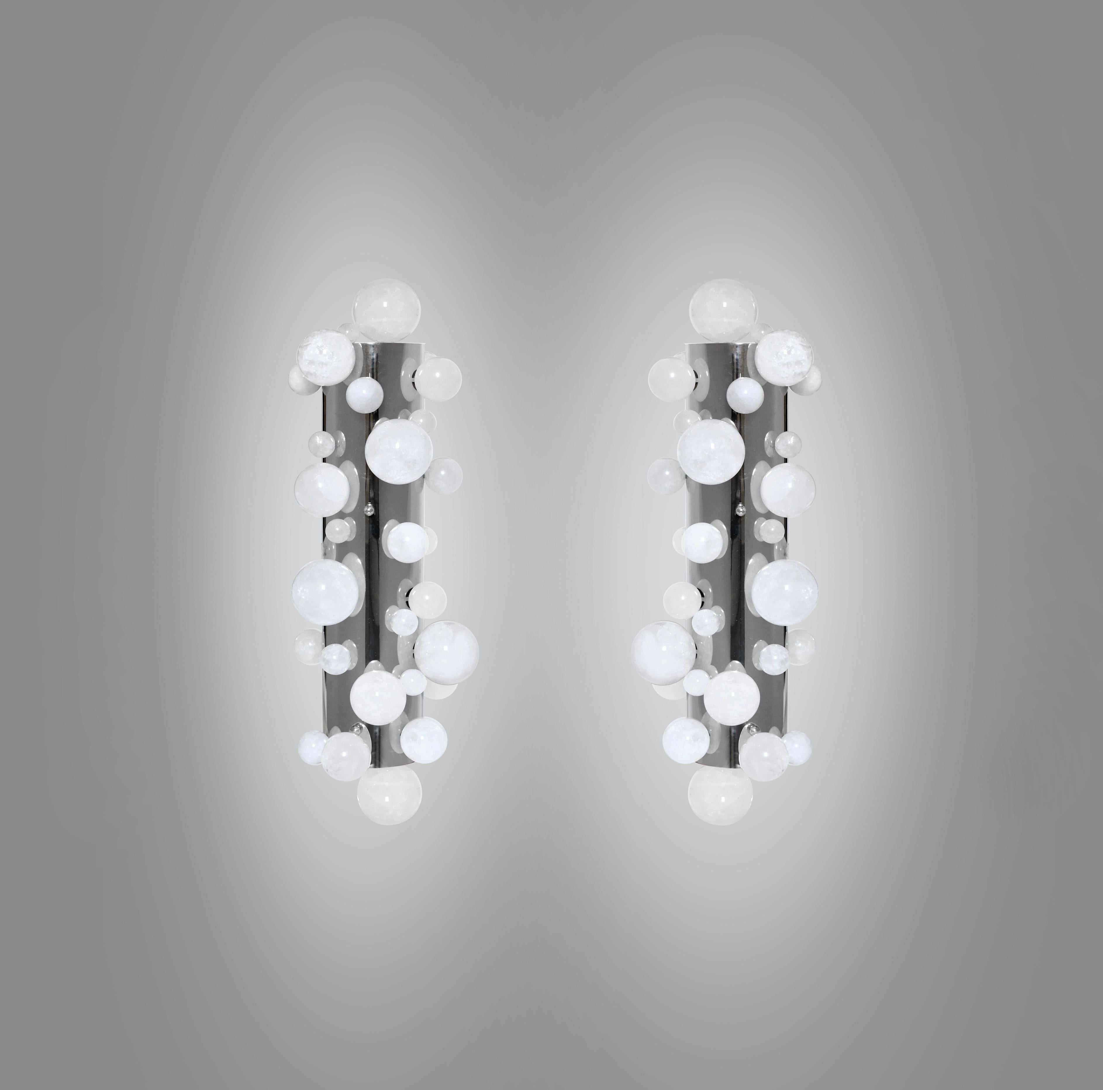 Pair of bubble rock crystal sconces with the polish nickel mounted. Created by Phoenix gallery NYC.
Each sconce installed three sockets. Use three 60w LED warm light bulbs. Total 180w max. Light bulbs included.
Recommend J-box size: 2