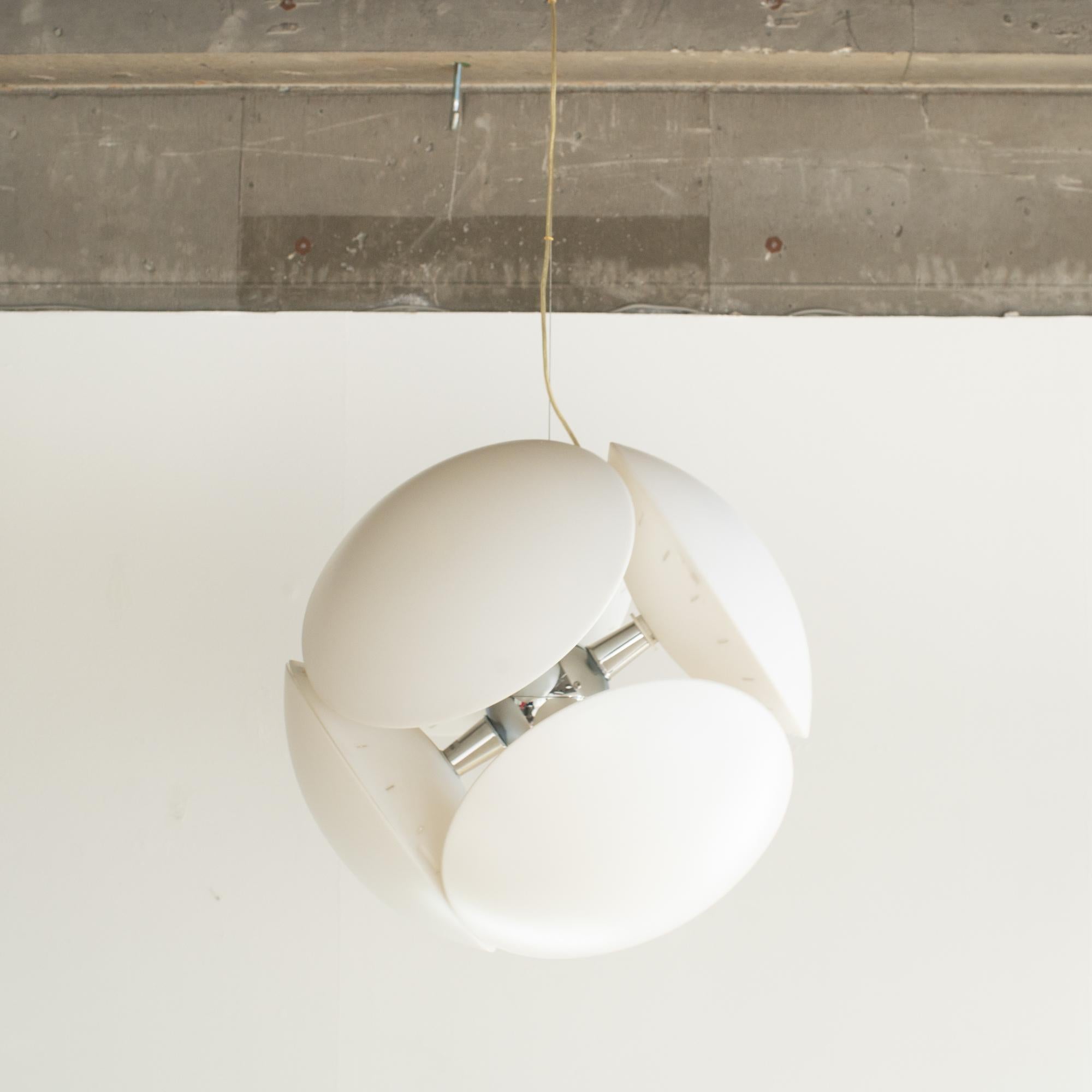 Pendant lamp designed by Valerio Bottin  around 2000. It is suitable for Y2K style pop interior. Also, Mid-century style and Space Age style. 
It was produced by Foscarini.  It's made of chrome metal in the center and six satin-finish polycarbonate