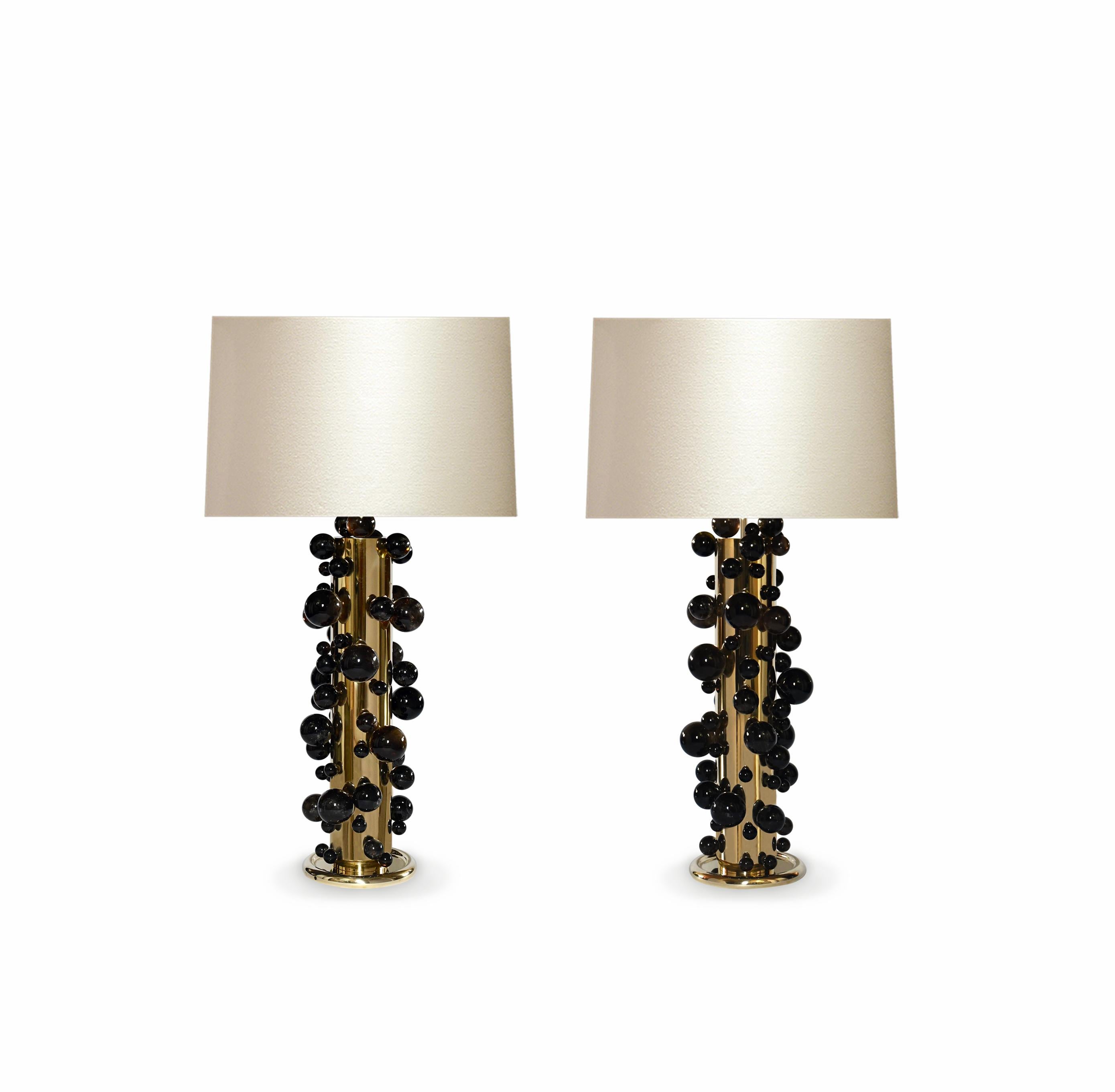 A tall pair of luxury dark rock crystal quartz bubble lamps with polish brass frame. Created by Phoenix Gallery, NYC.
Each lamp installed two sockets.
To the top of the rock crystal 25.75