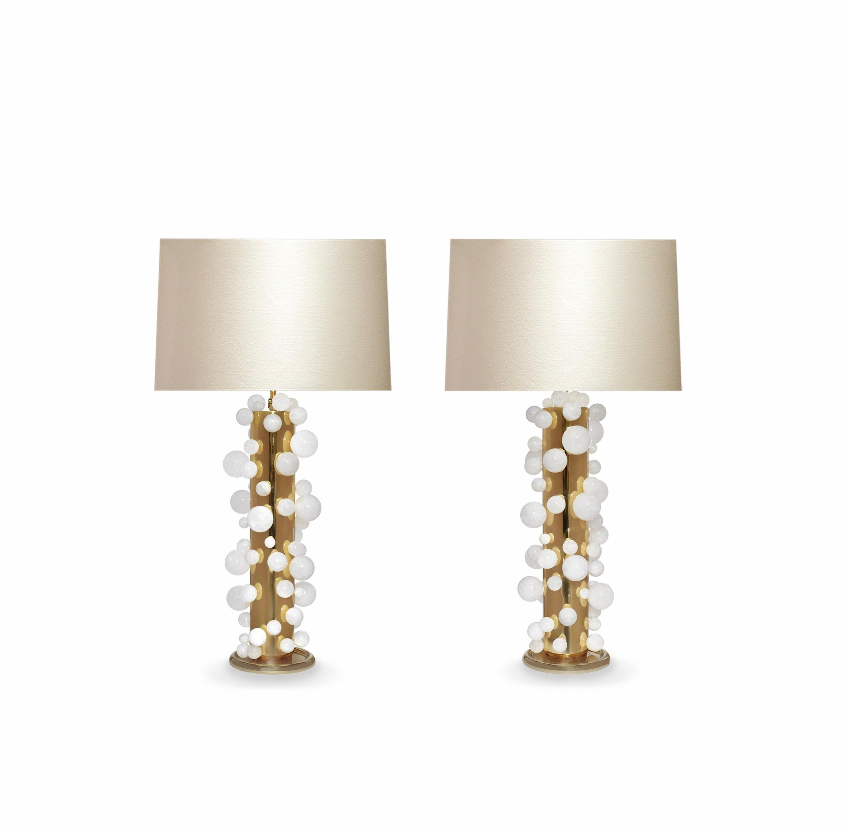 A tall pair of luxury rock crystal quartz bubble lamps with polished brass frames. Created by Phoenix Gallery, NYC.
Each lamp installed two sockets.
To the top of the rock crystal 25.75