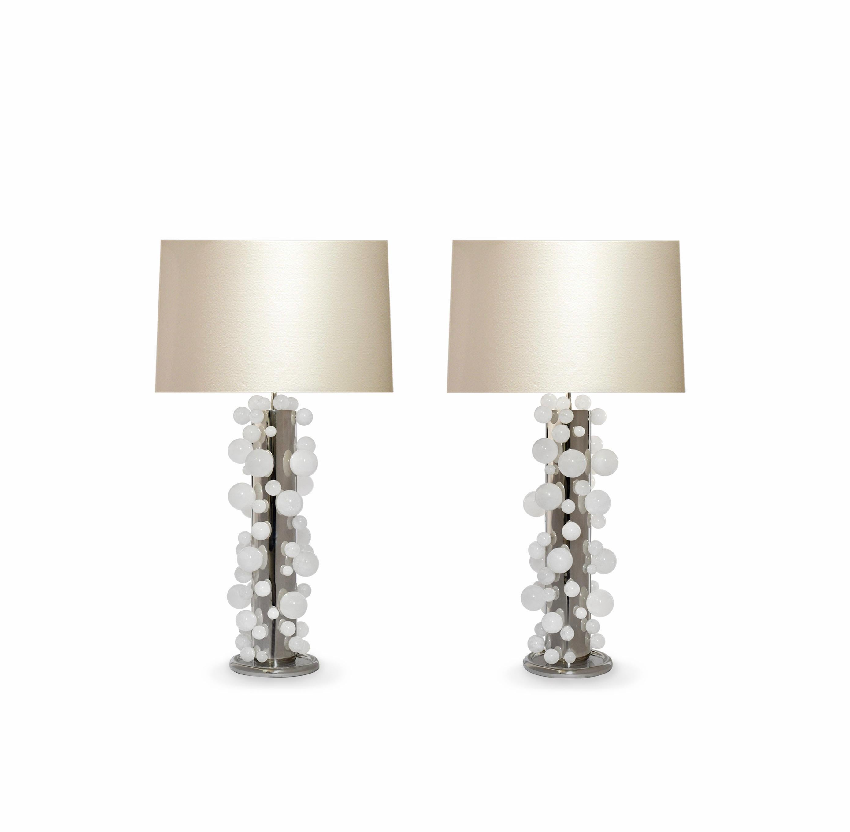 A tall pair of luxury rock crystal quartz bubble lamps with polished nickel frames. Created by Phoenix Gallery, NYC.
Each lamp installed two sockets.
To the top of the rock crystal 25.75