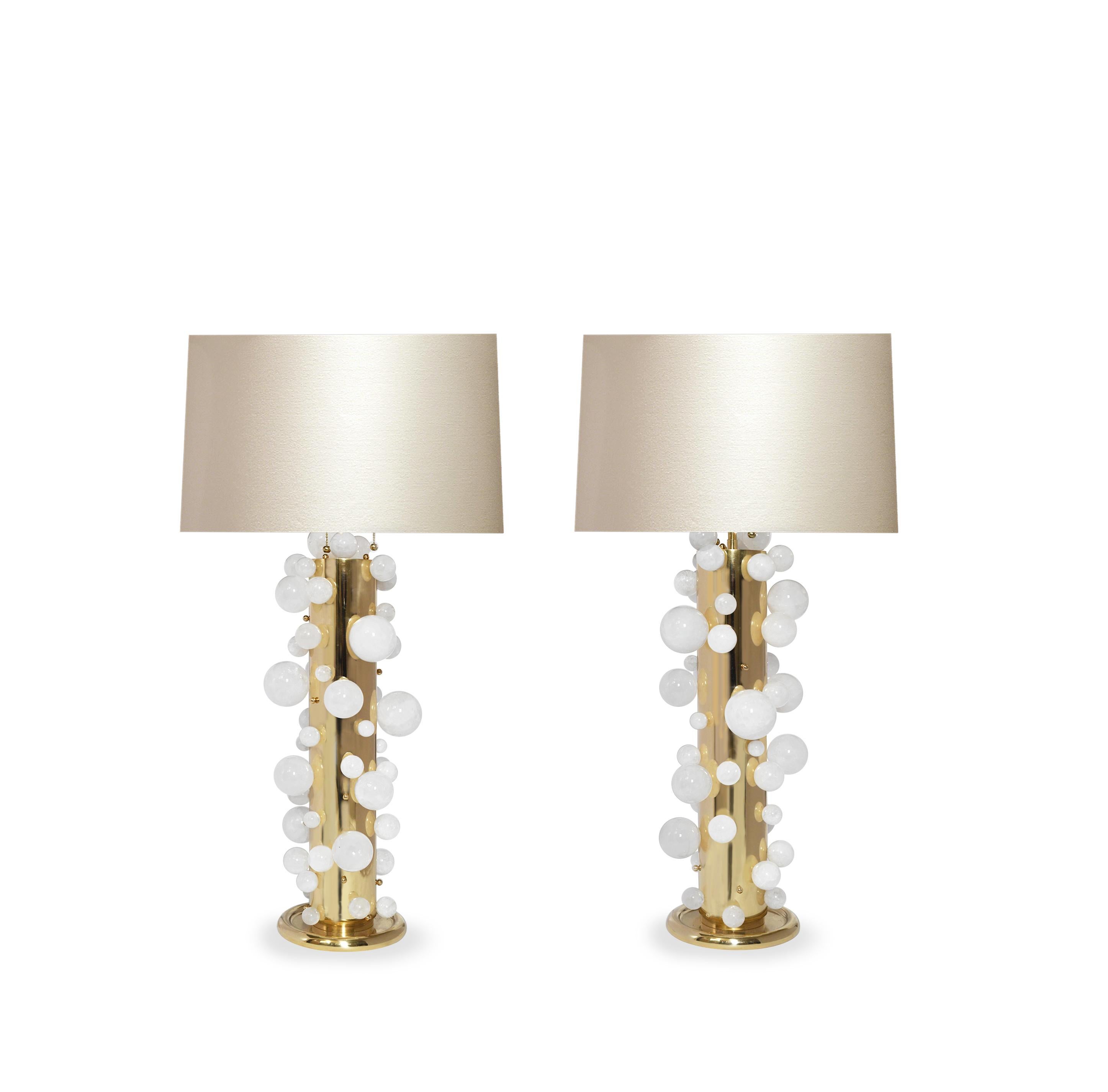 A tall pair of luxury rock crystal quartz bubble lamps with polish brass frames. Created by Phoenix Gallery, NYC.
Each lamp installed two sockets.
To the top of the rock crystal 25.75