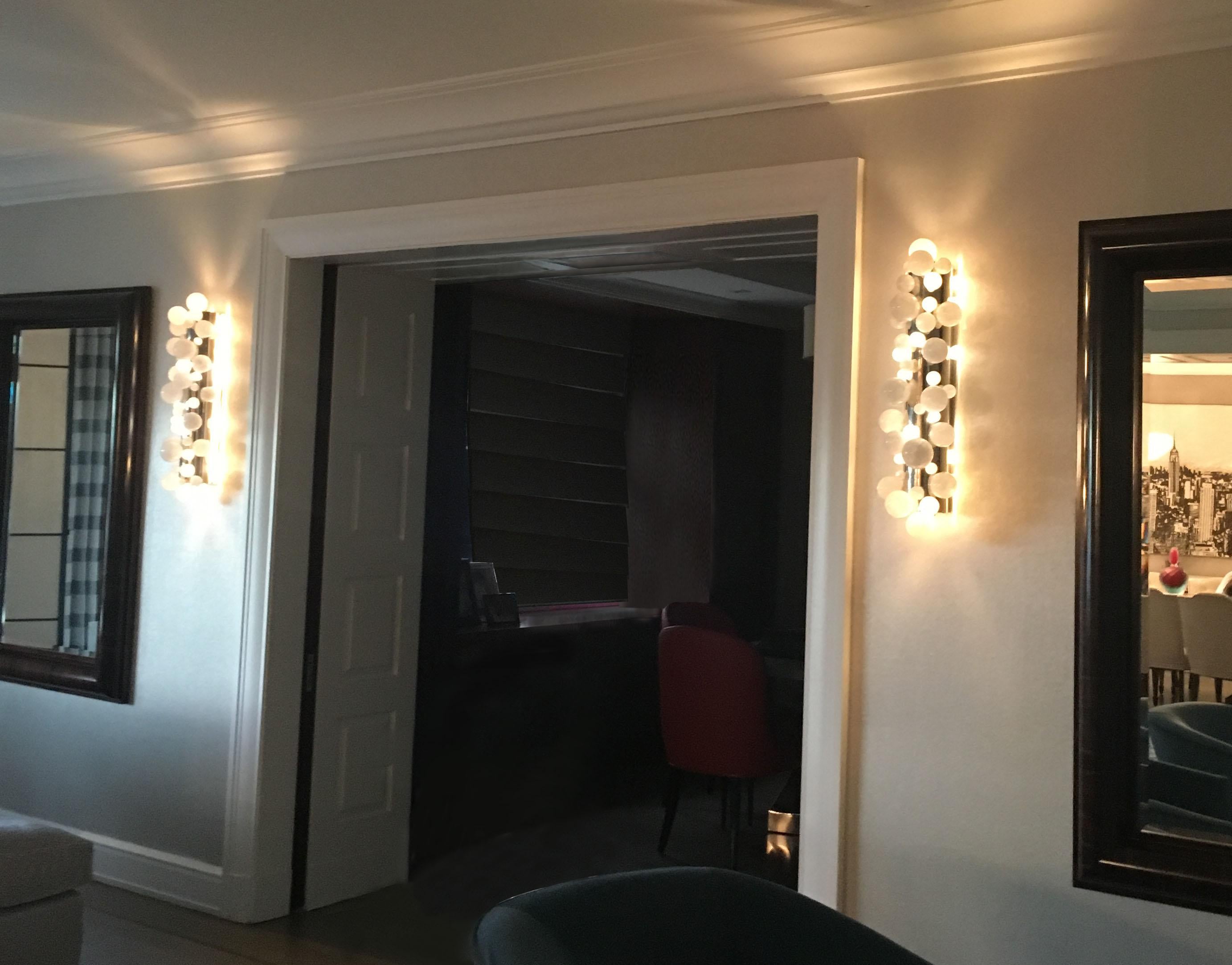 Group of four bubble rock crystal sconces with the polish nickel mounted. Created by Phoenix gallery NYC.
Each sconce installed four sockets. Use four 60w LED warm light bulbs. Total 240w max. Light bulbs included. 
Custom size upon