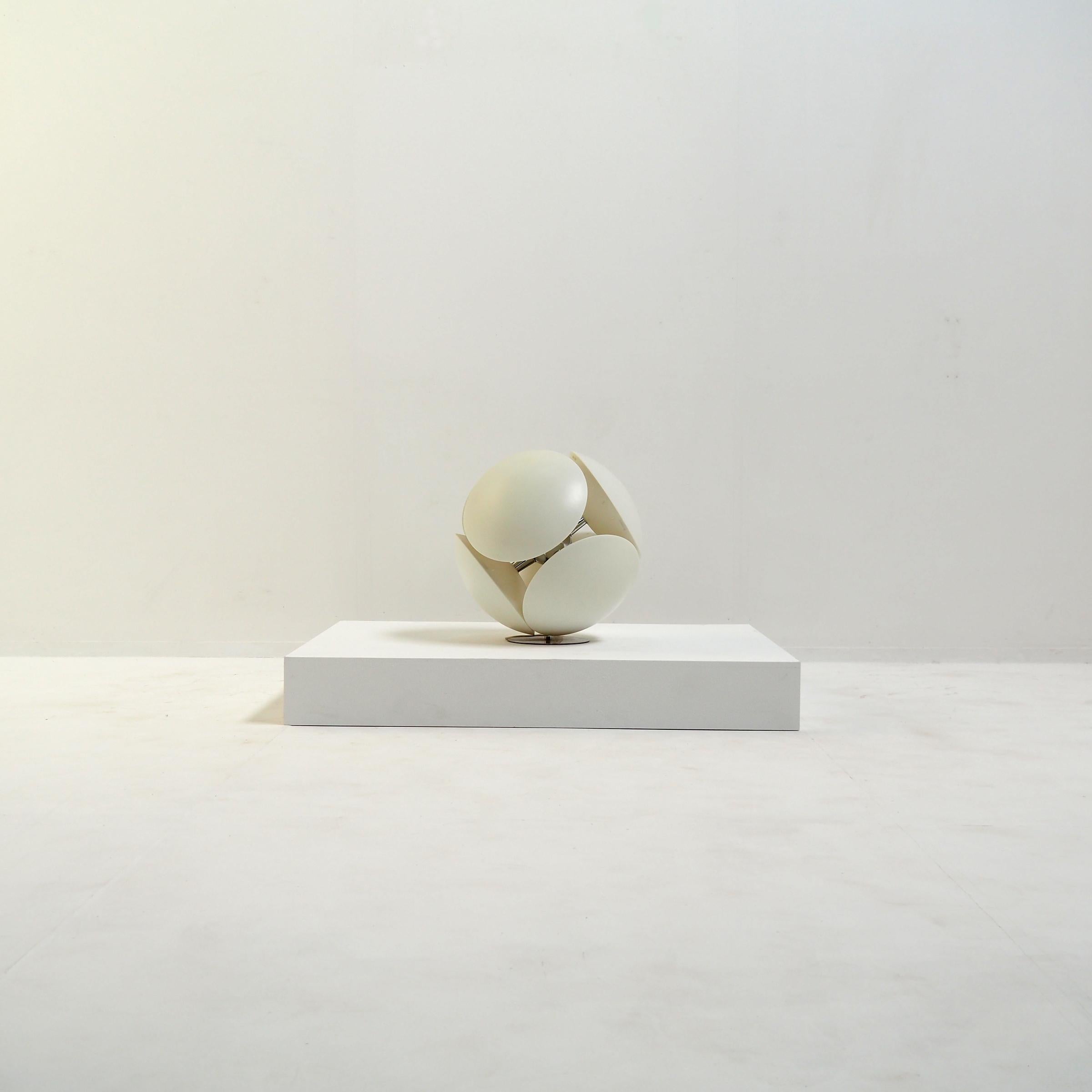 Floor lamp made out of six disc-shaped diffusers creating a beautiful sphere. It’s designed by Valerio Bottin for Foscarini, Murano Italy.

It’s made of a polycarbonate plastic with satin finish and stands on a chrome metal disc.