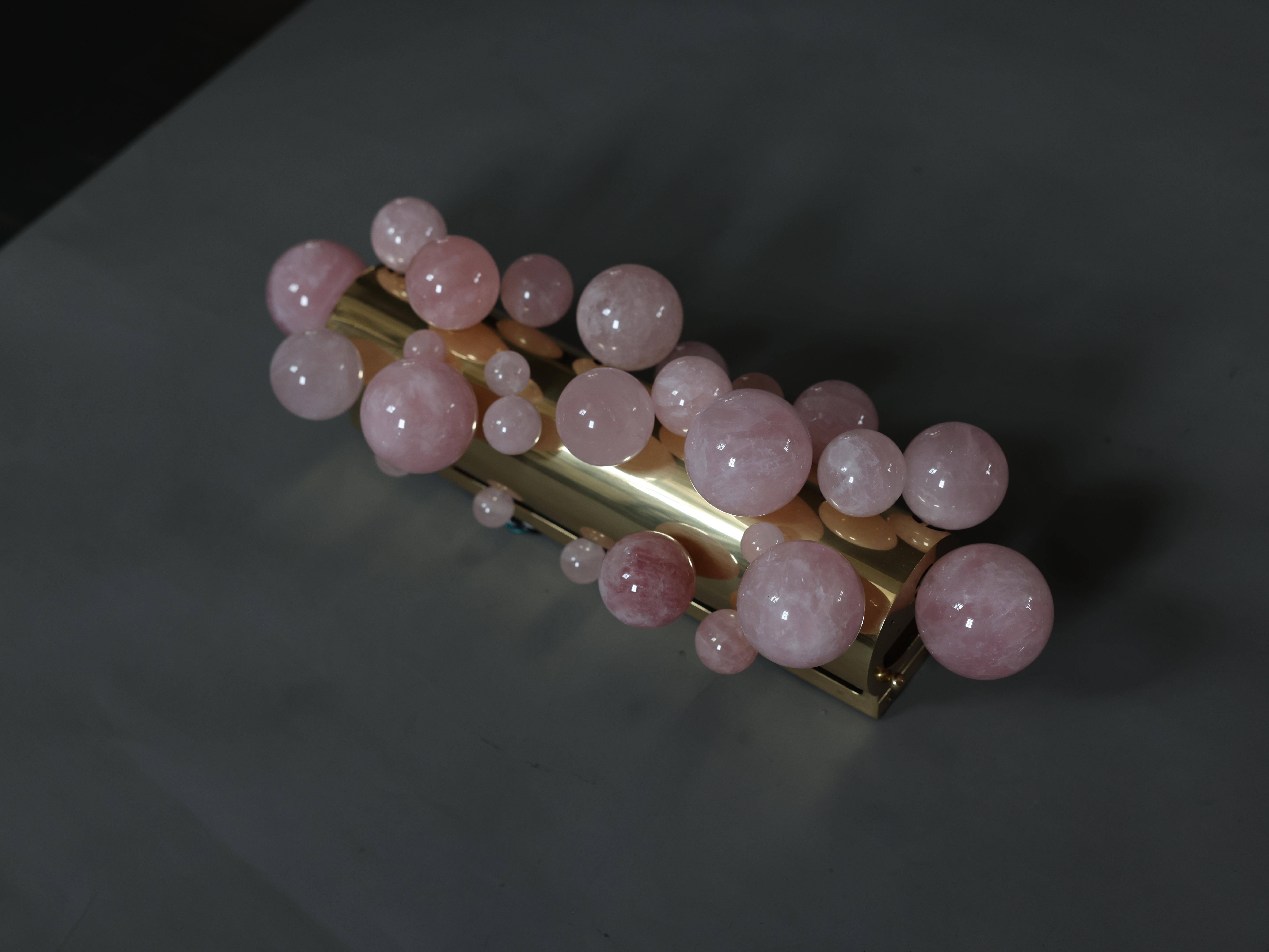 Pair of pink bubble Quartz sconces with polish brass frame
created by Phoenix gallery.

Each sconce install the two large sockets.160 w total.

2inch by 4 inch jbox recommend 