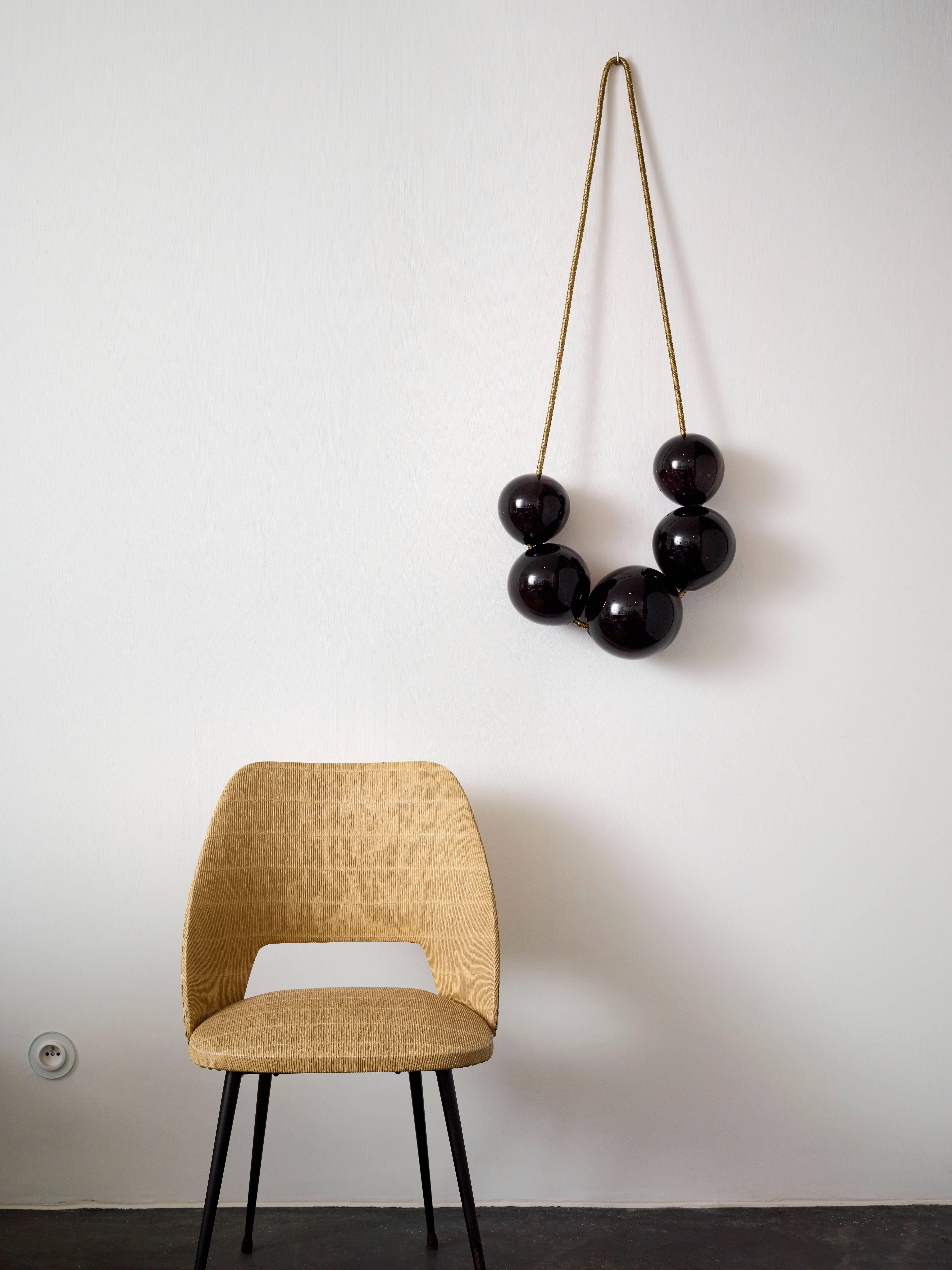Contemporary wall hanging ornament with handblown black beads.
The ‘Bubbles’ looks like an oversized necklace. 
The handblown glass beads are embedd in a chain of high quality Italian brass.

There are two models available:
Large 20 cm x 50 cm