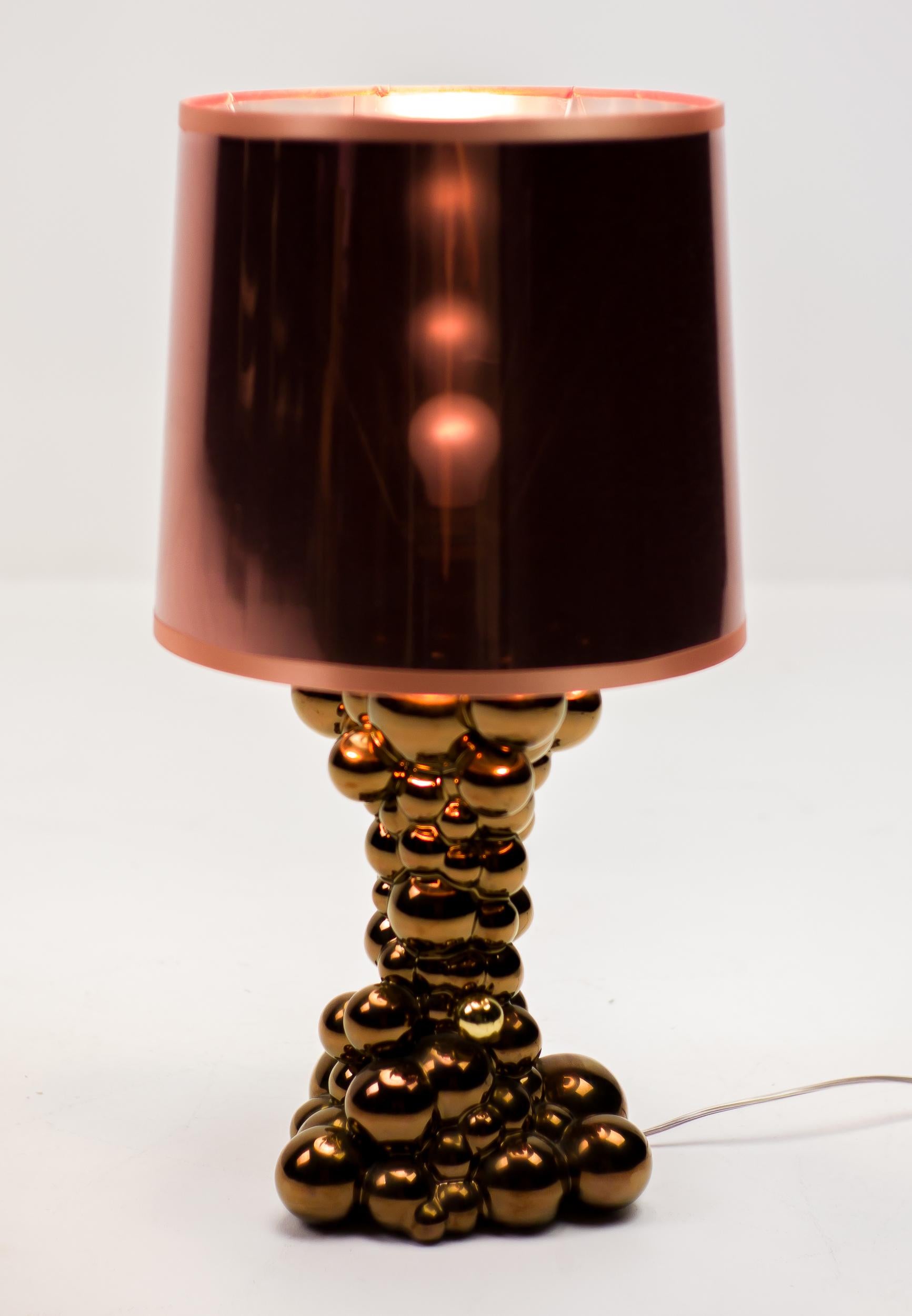 Rare Bubbles table lamp in glossy copper ceramic designed by Jaime Hayon for Bosa. 
The bubbles lamp evokes the effervescent effect of a flurry of bubbles. The material that is transformed by a touch and a body that fills with light. To achieve the