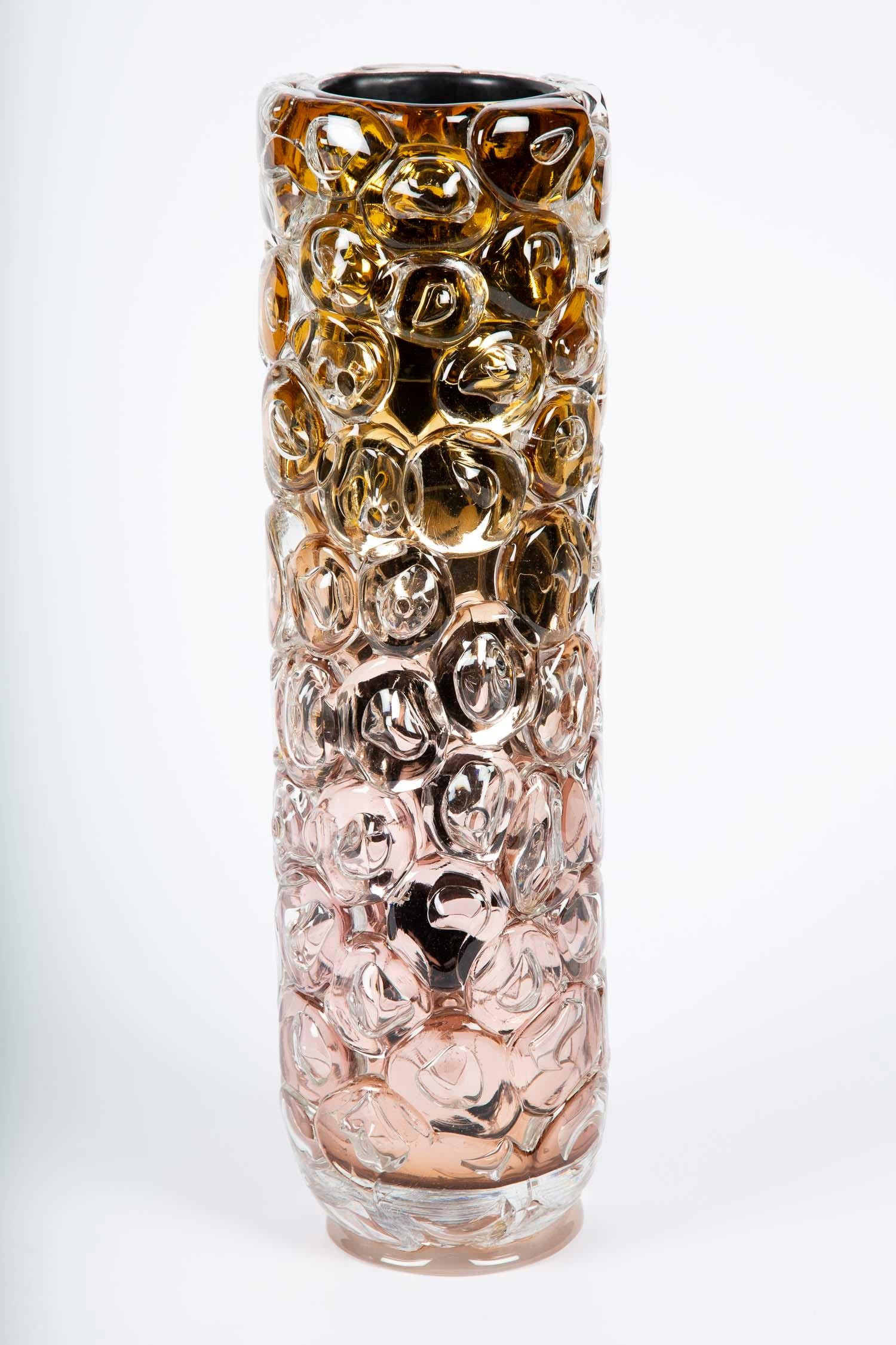 Bubblewrap in Gold is a hand-blown and sculpted vase created from pink and gold glass, with a mirrored interior by the British artist Allister Malcolm. Playful yet elegant, Malcolm has formed oversized bubbles on the exterior of this handcrafted and