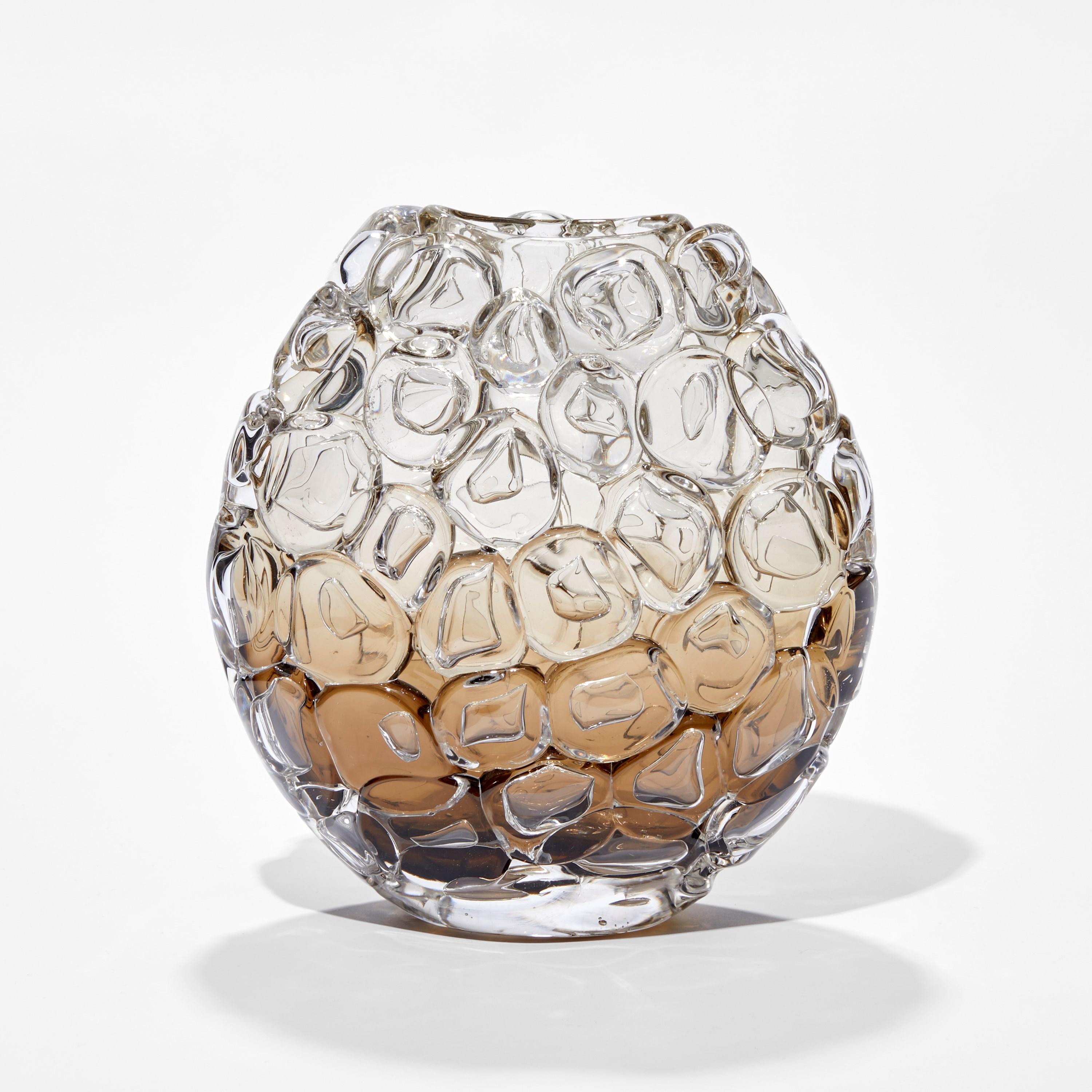 'Bubblewrap in Olivin Ombre I' is a handblown and sculpted vase created from glass by the British artist, Allister Malcolm.

Playful yet elegant, Malcolm has formed oversized bubbles on the exterior of this handcrafted and blown piece. The title