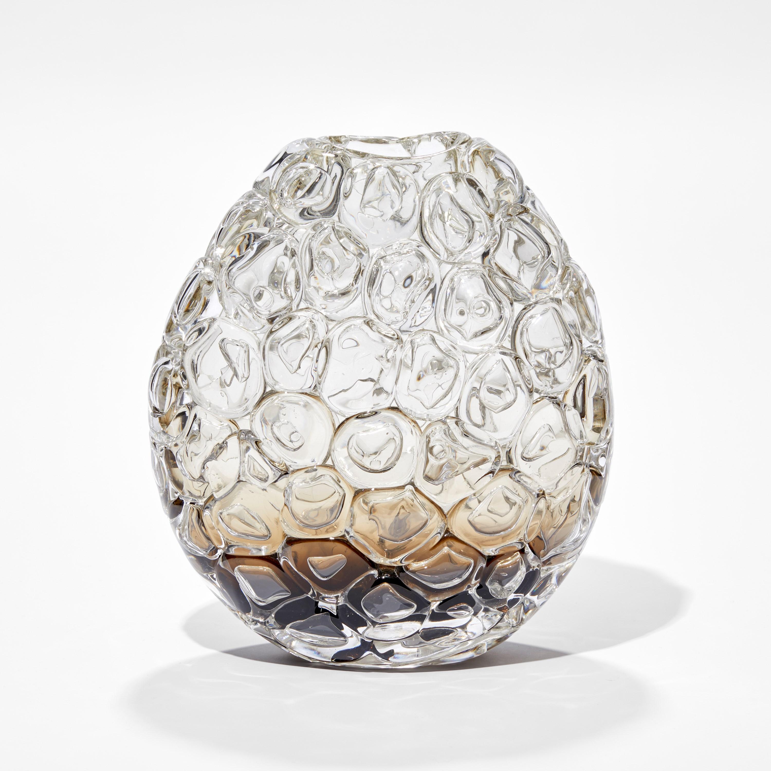 'Bubblewrap in Olivin Ombre II' is a handblown and sculpted vase created from glass by the British artist, Allister Malcolm.

Playful yet elegant, Malcolm has formed oversized bubbles on the exterior of this handcrafted and blown piece. The title
